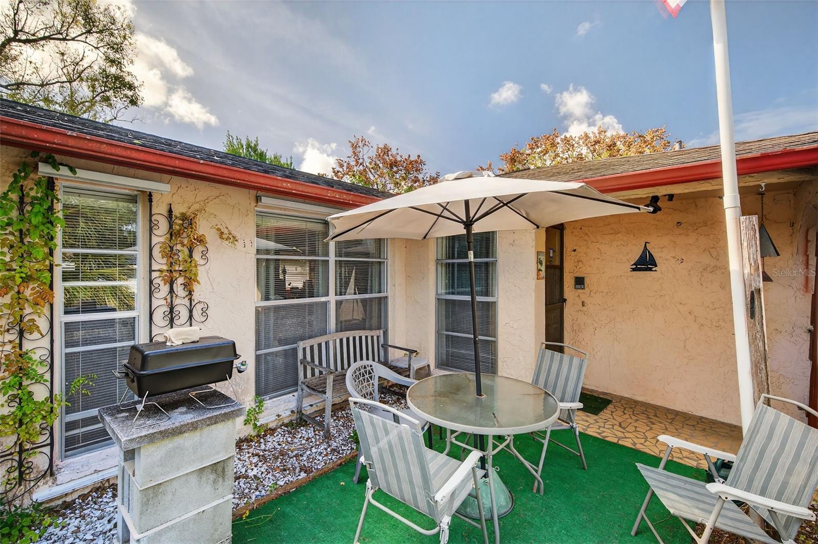 Lovely private patio at front of home offers a great place to relax when and enjoy the Florida climate