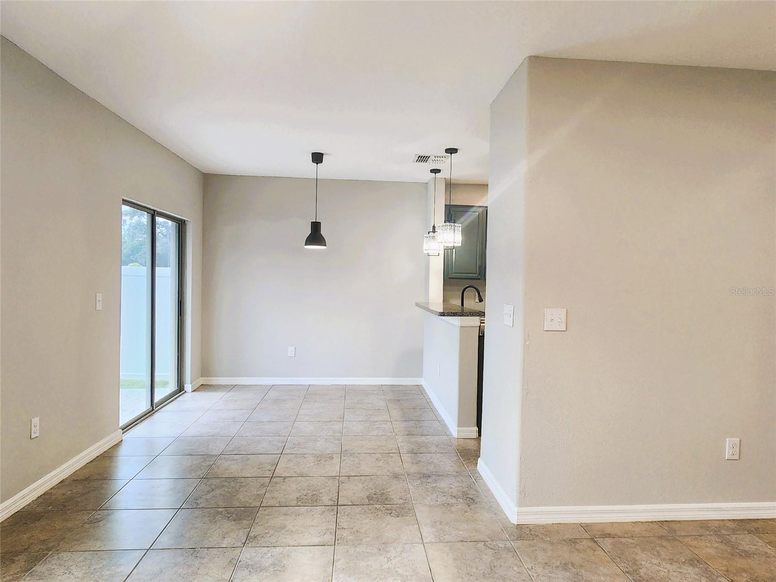East view from living room into dining room