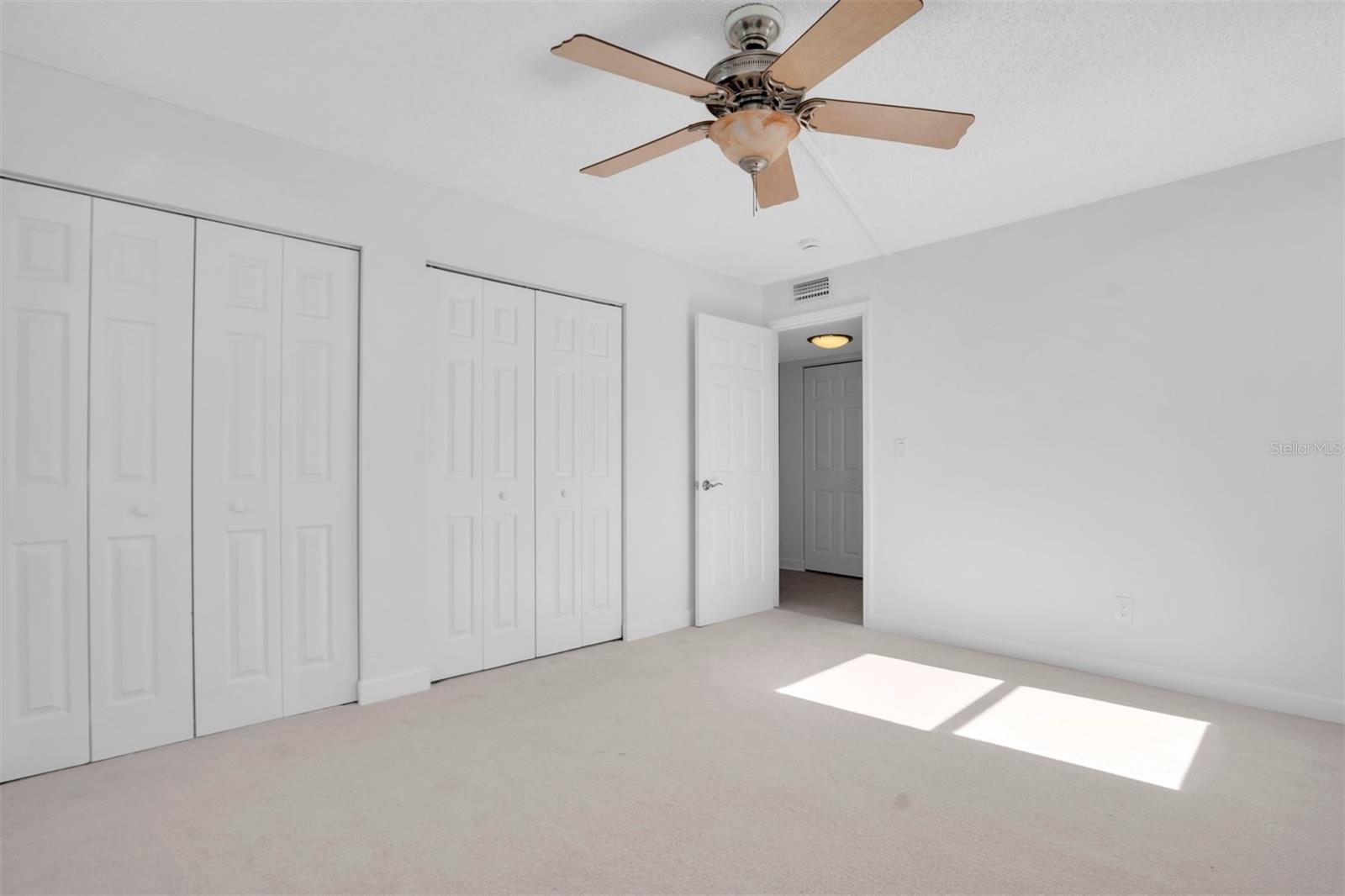 GUEST BEDROOM WITH DOUBLE CLOSETS