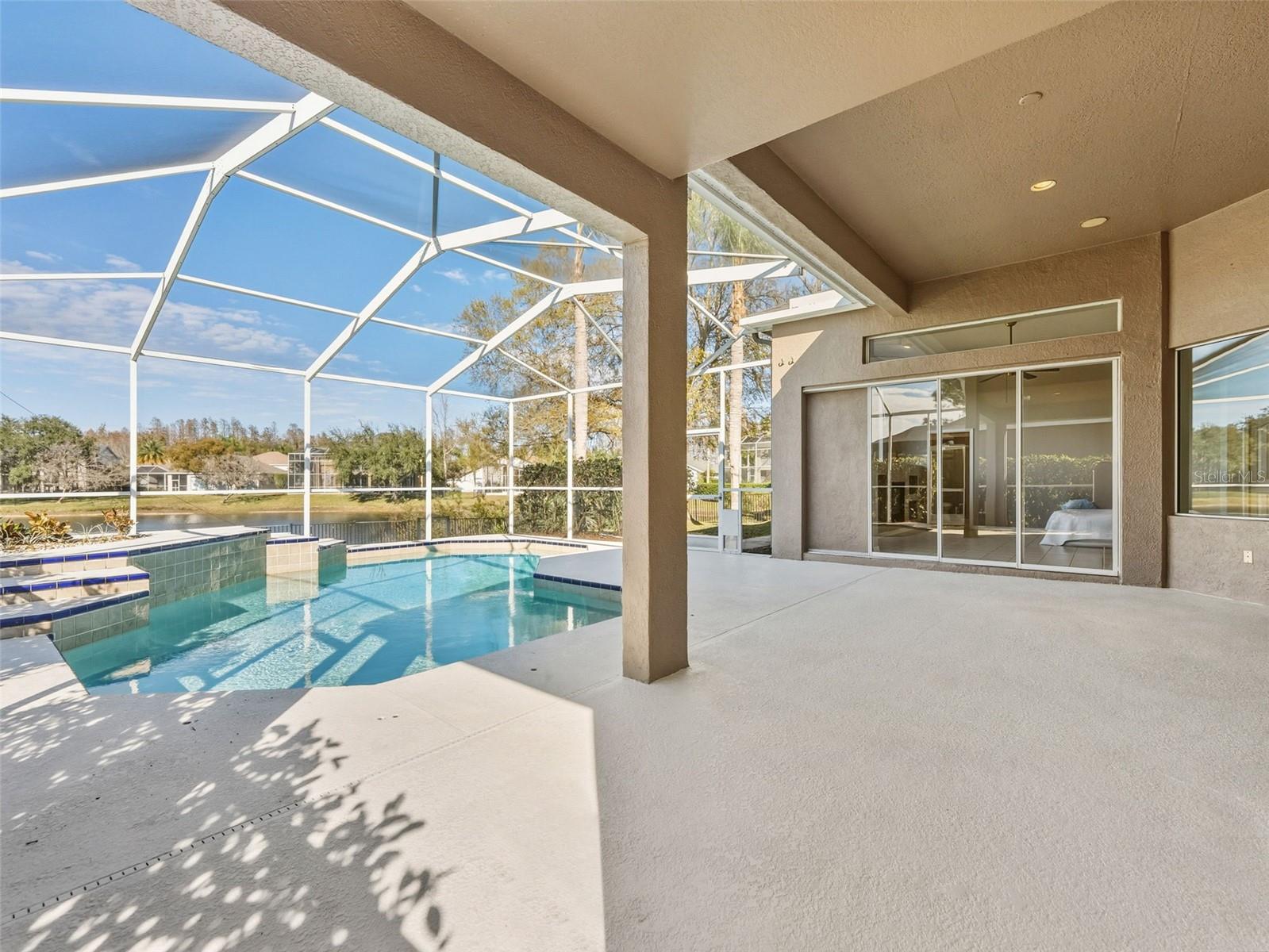 Caged lanai - view from primary bedroom side