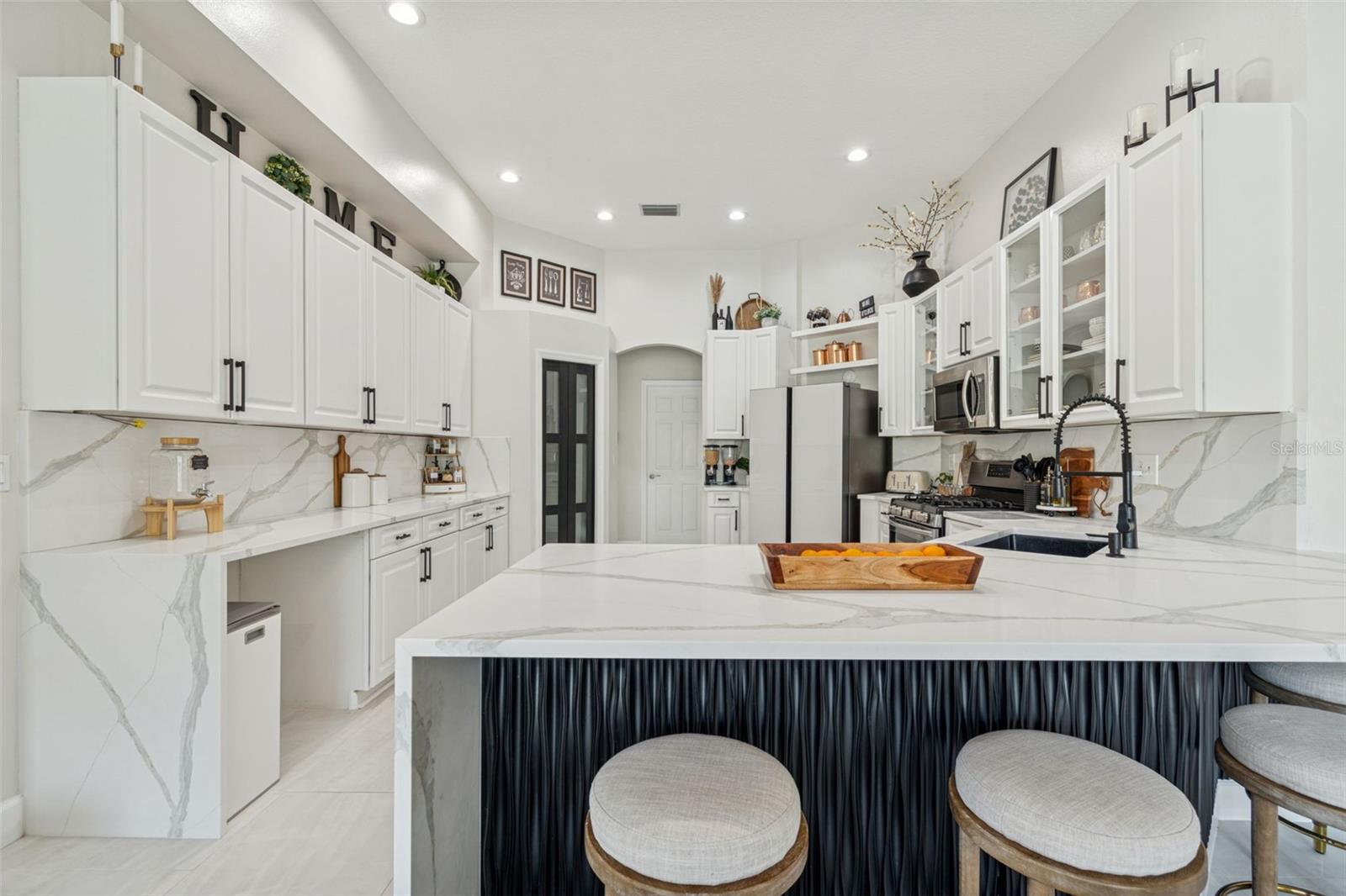 Recent improvement: quartz countertops with double waterfall.