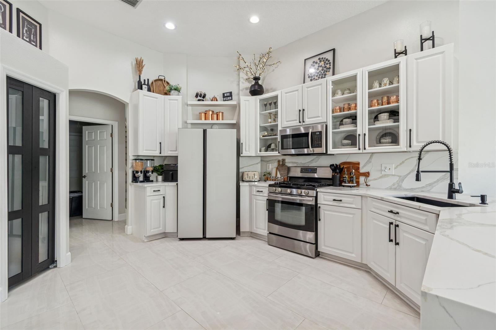 New pantry door and new refrigerator.