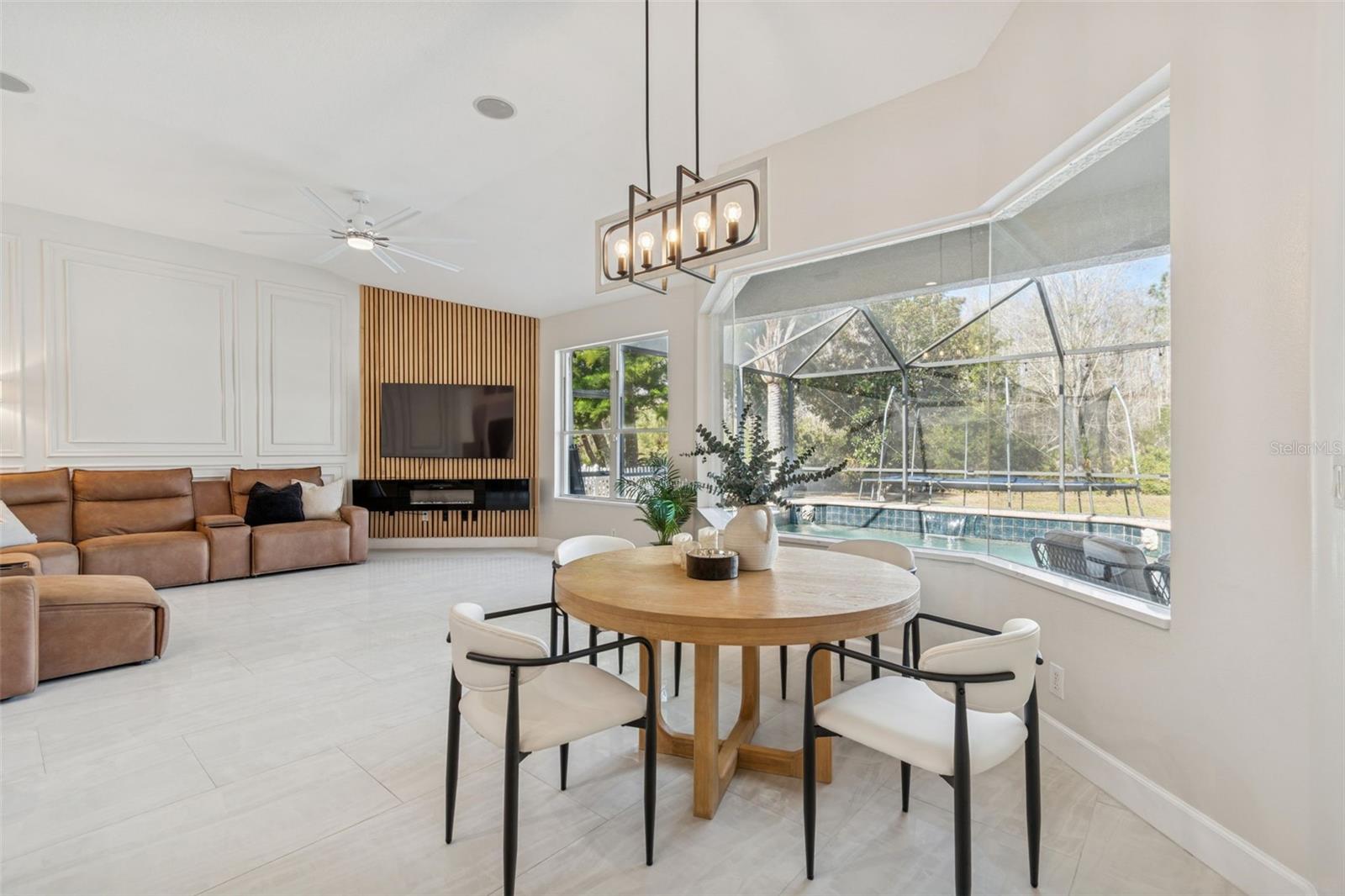 Custom decorative wall and new fireplace in family room.