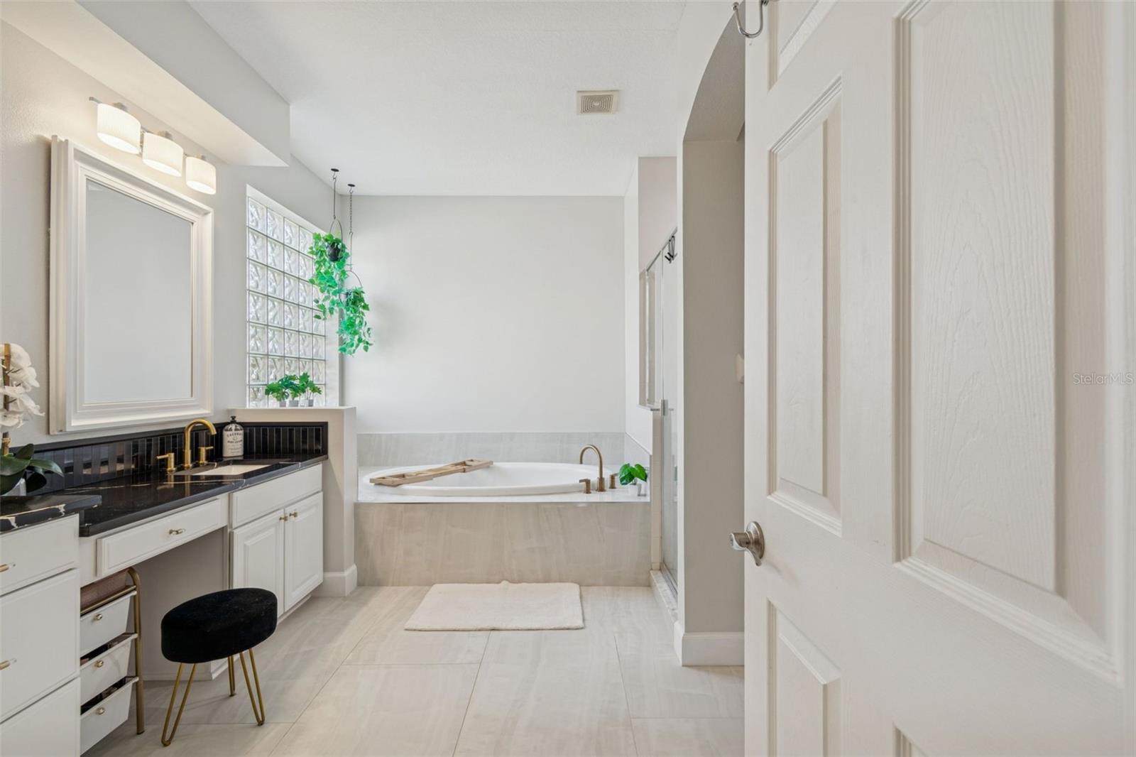 Soaking tub and separate shower.