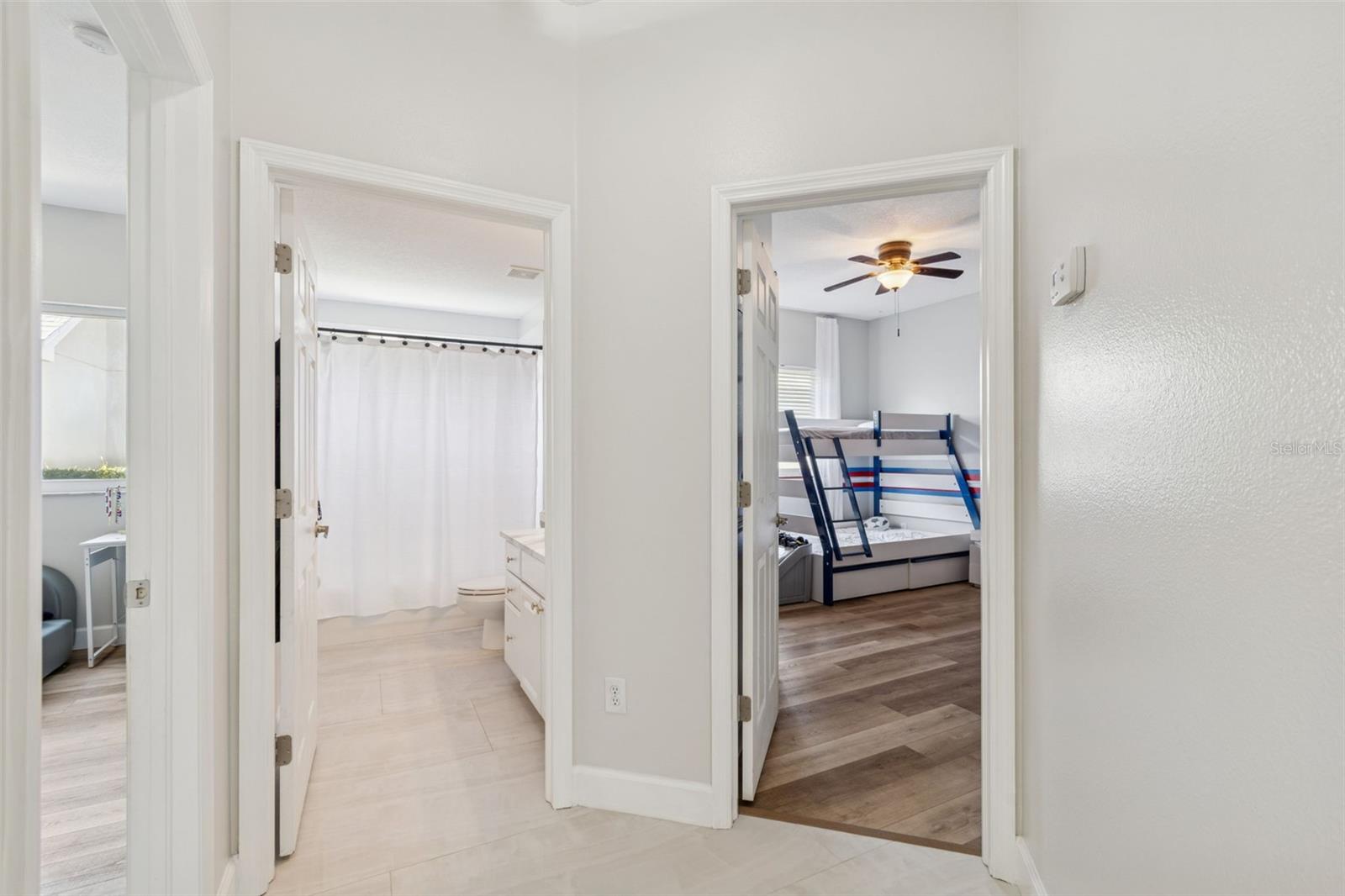 On the other side of the home are two bedrooms. They share a full bathroom.