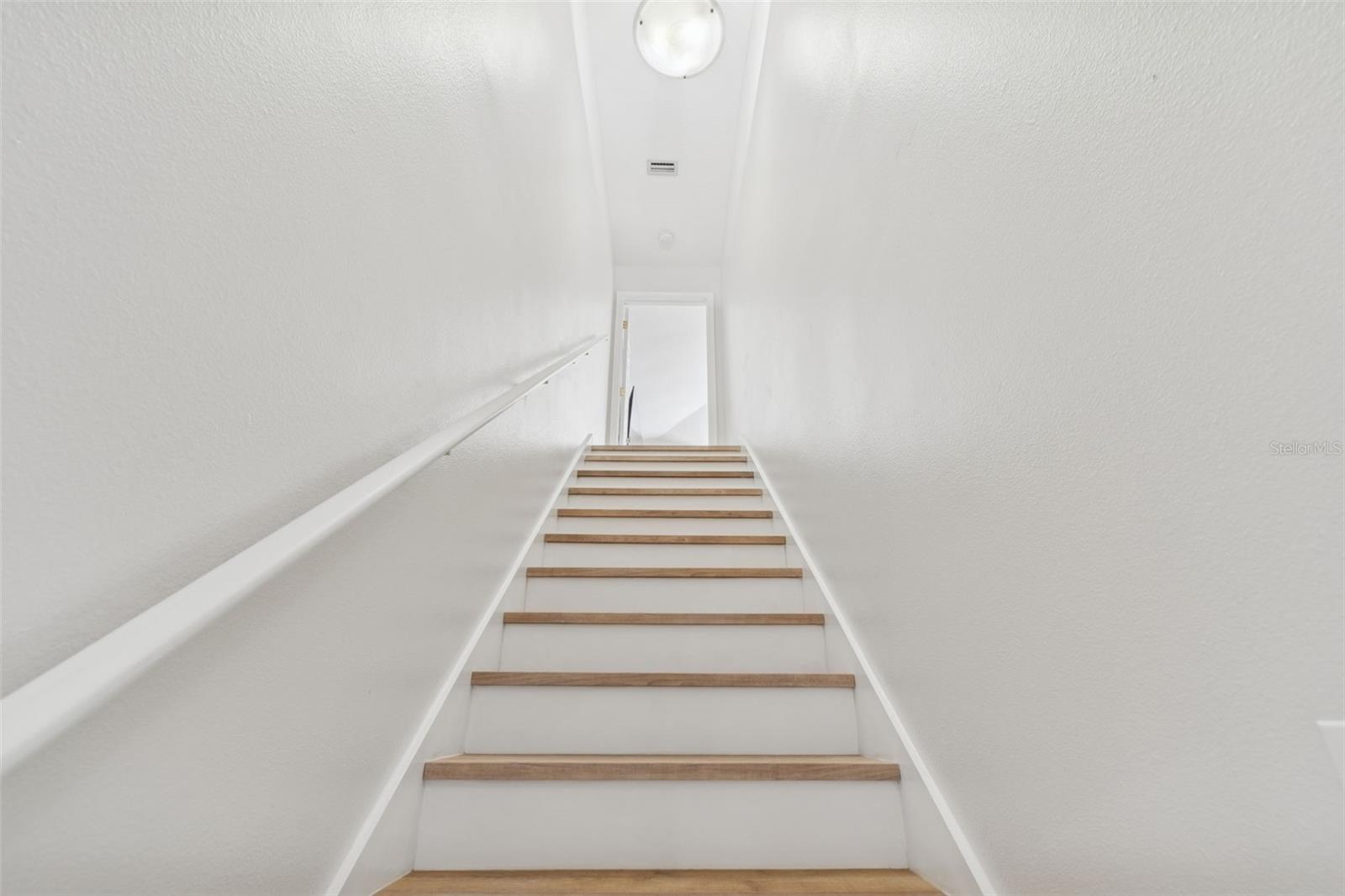 Stairs up the loft. Did we mention there is NO CARPET anywhere in the home?