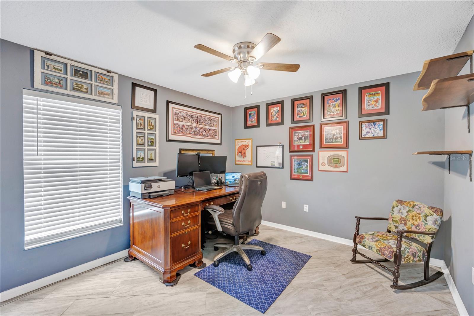 Bedroom #3 has tile flooring, ceiling fan and built-in closet.