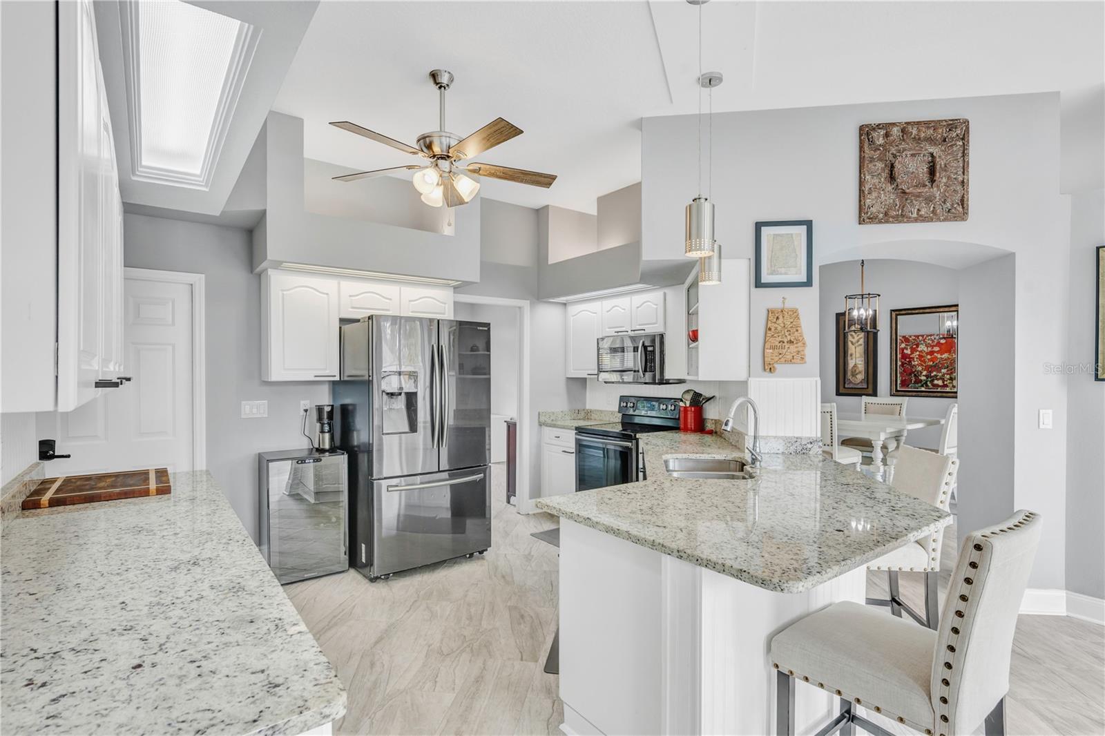 There is a breakfast bar and ample counter space for meal prep and entertaining.