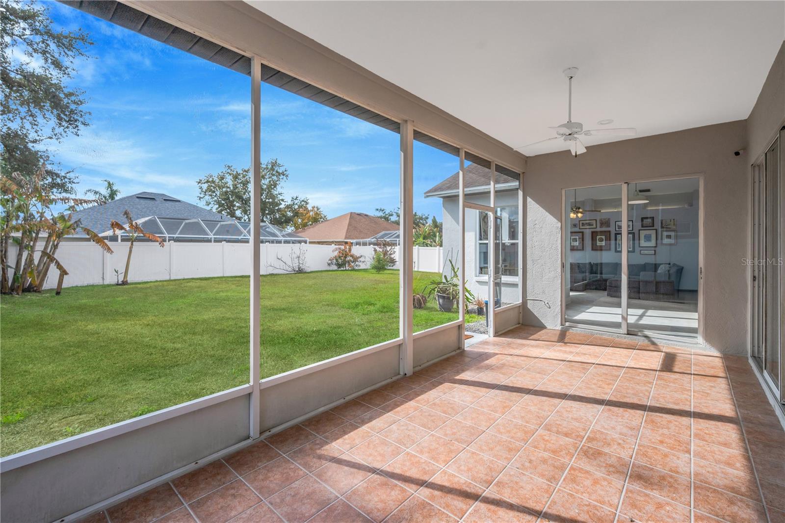 The screened patio is 22.8 X 9.11 with tile and ceiling fans.