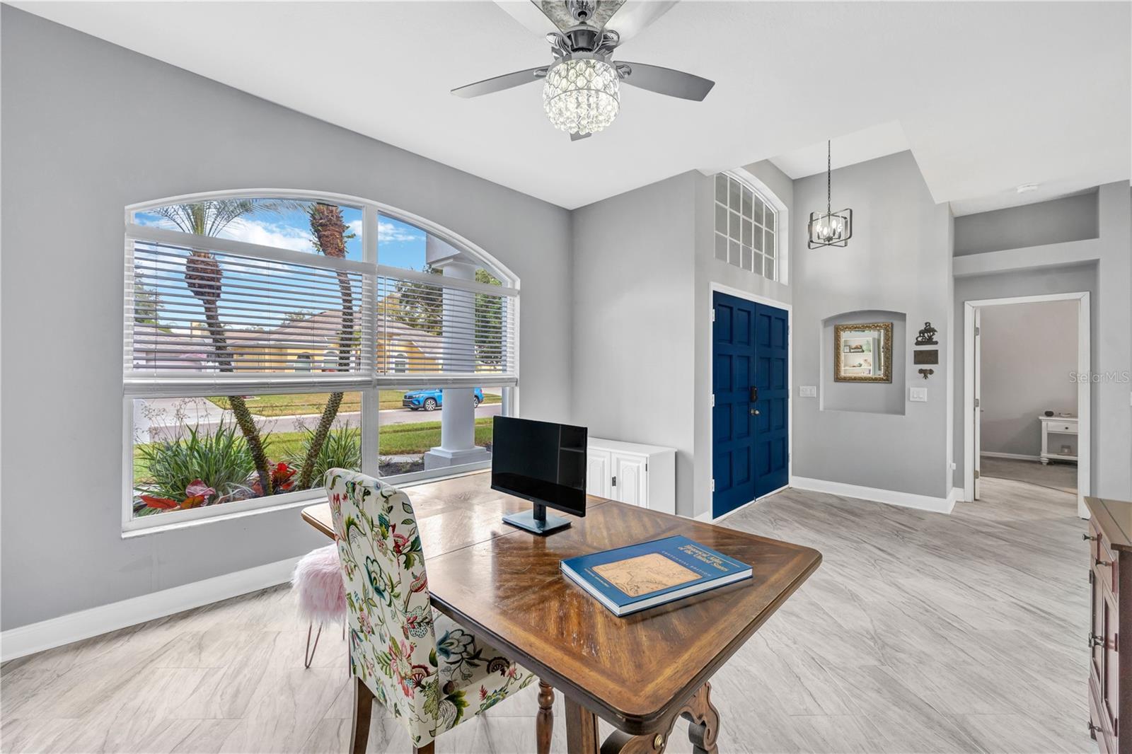 Current home owners use the living room as an elegant office.