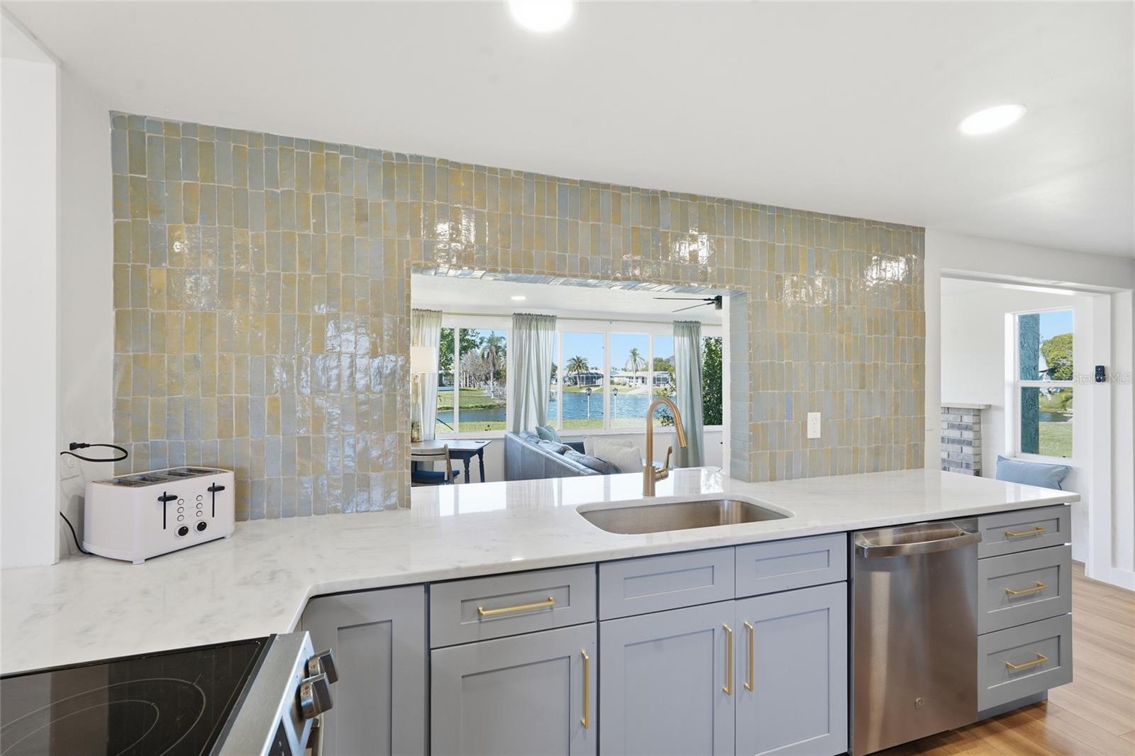 Kitchen View Of Secondary Living Room And Water