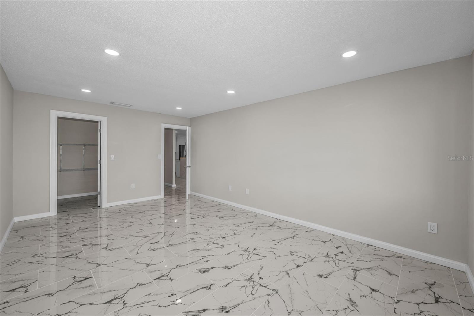 Guest bedroom with walk-in closet