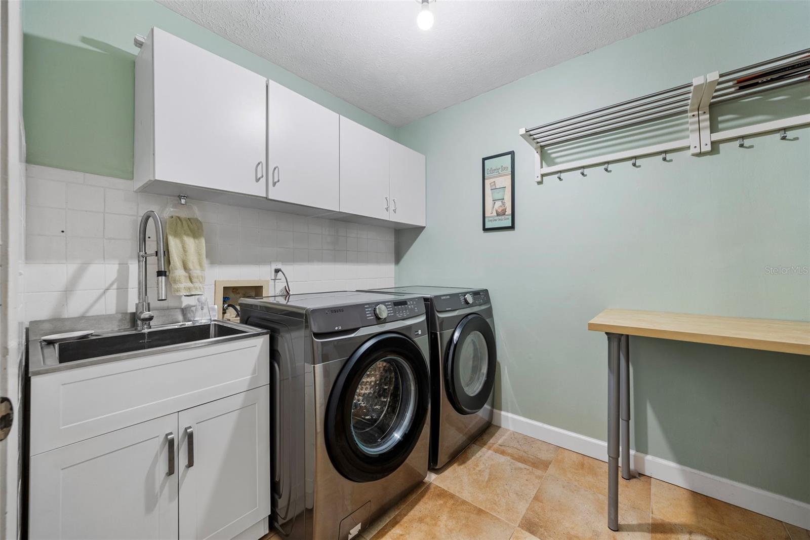 Laundry room with utility sink and storage!