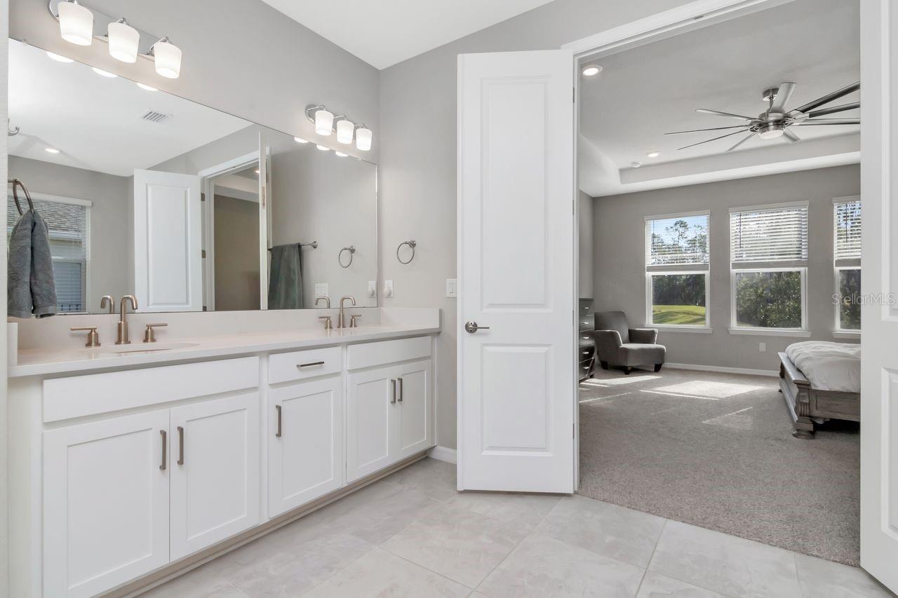 Primary Ensuite with soaking tub, glass enclosed shower, dual vanity and private water closet