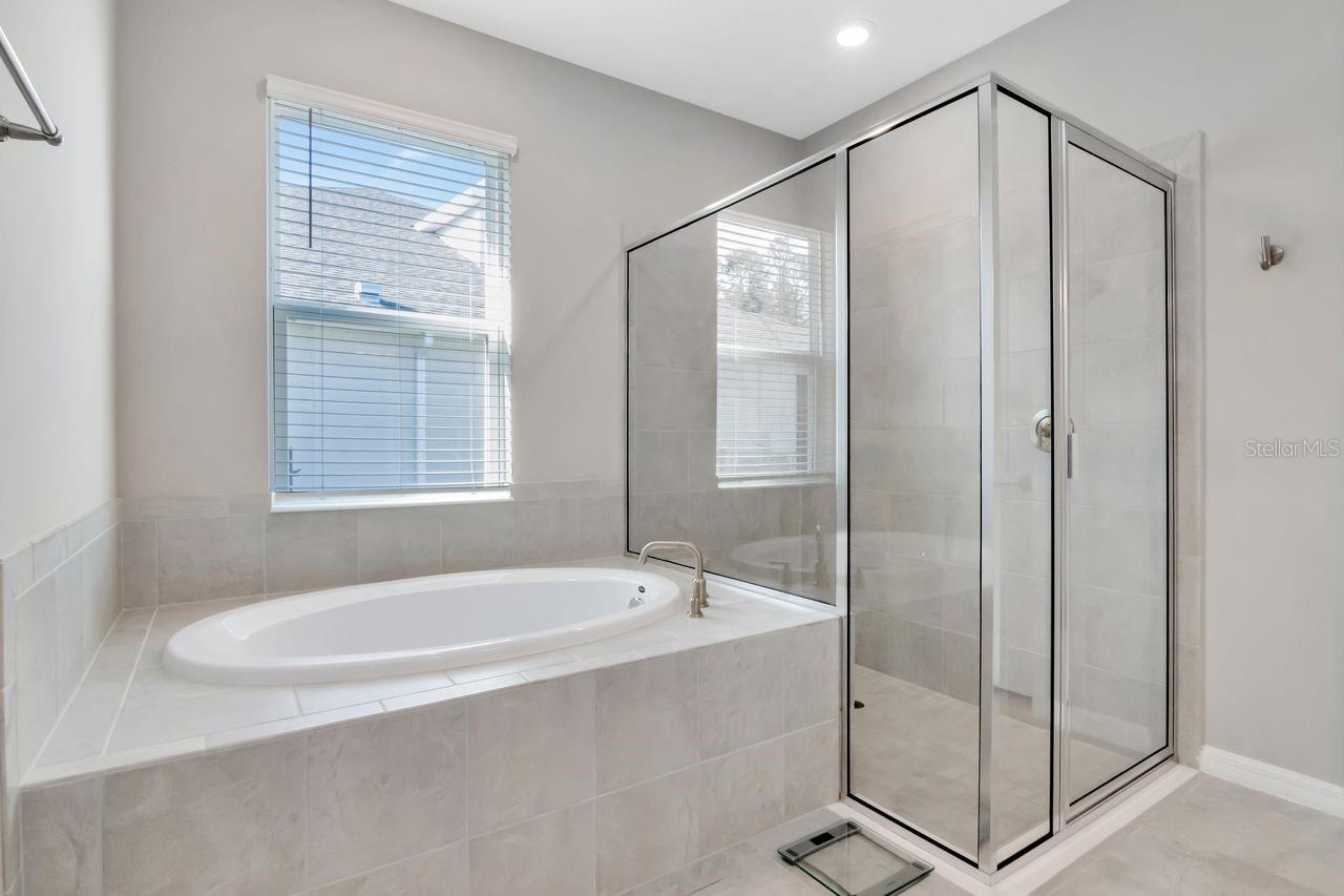 Primary Ensuite with soaking tub, glass enclosed shower, dual vanity and private water closet