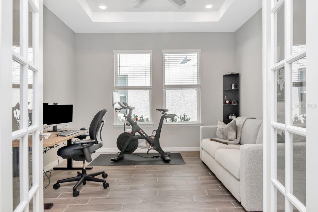 Office/Bonus Space with tray ceiling and french doors.