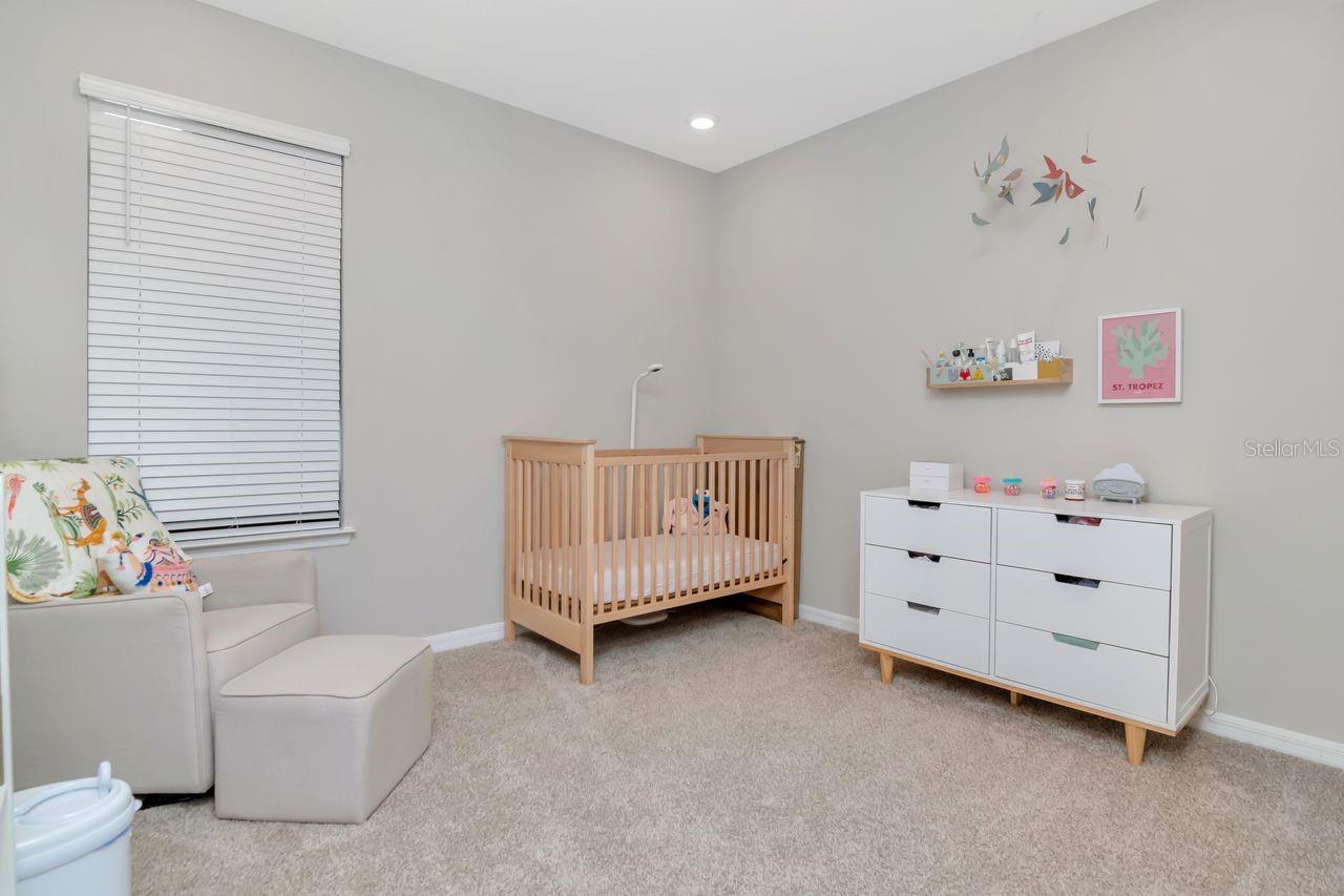 Bedroom 2 located in the front of the home next to bathroom.