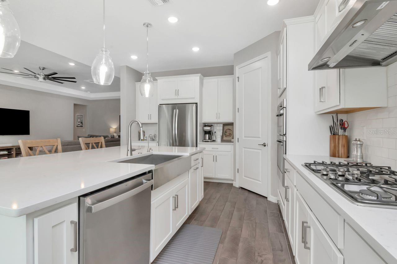 Gourmet Kitchen with large island, stainless steel appliances, upgraded lighting and lots of storage.