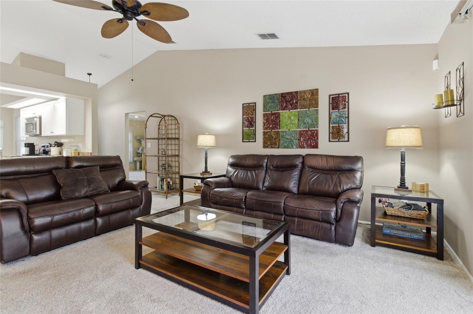 Living Room w/sliders to Pool and Screened Lanai