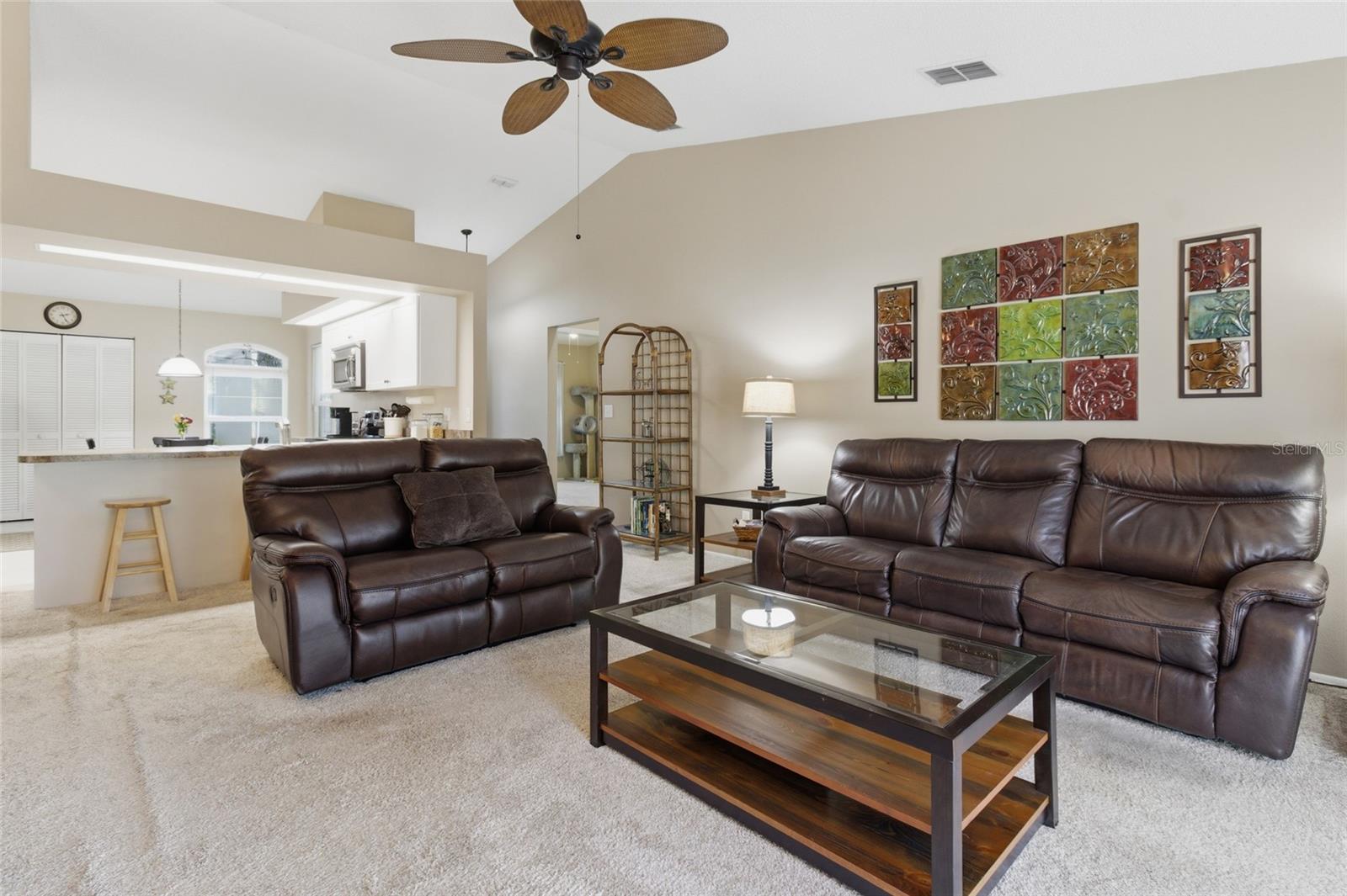 Living Room w/sliders to Pool and Screened Lanai
