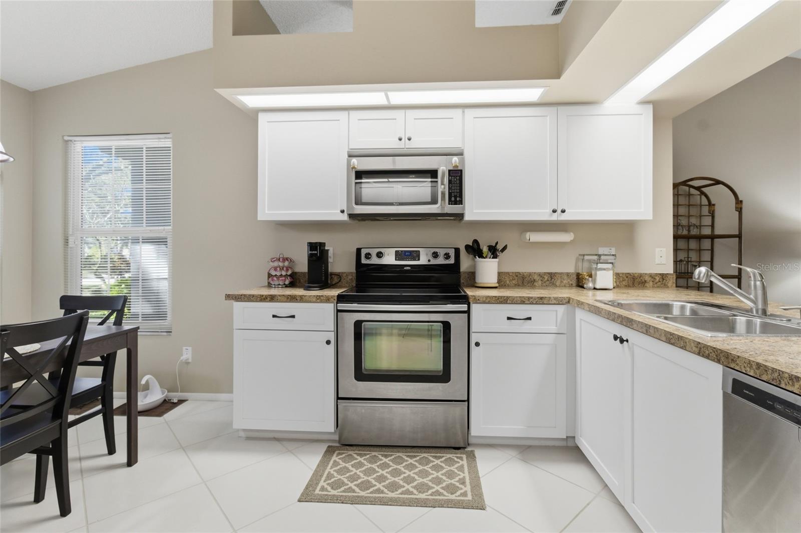 Open Concept Kitchen with Breakfast Bar and Vaulted Ceilings