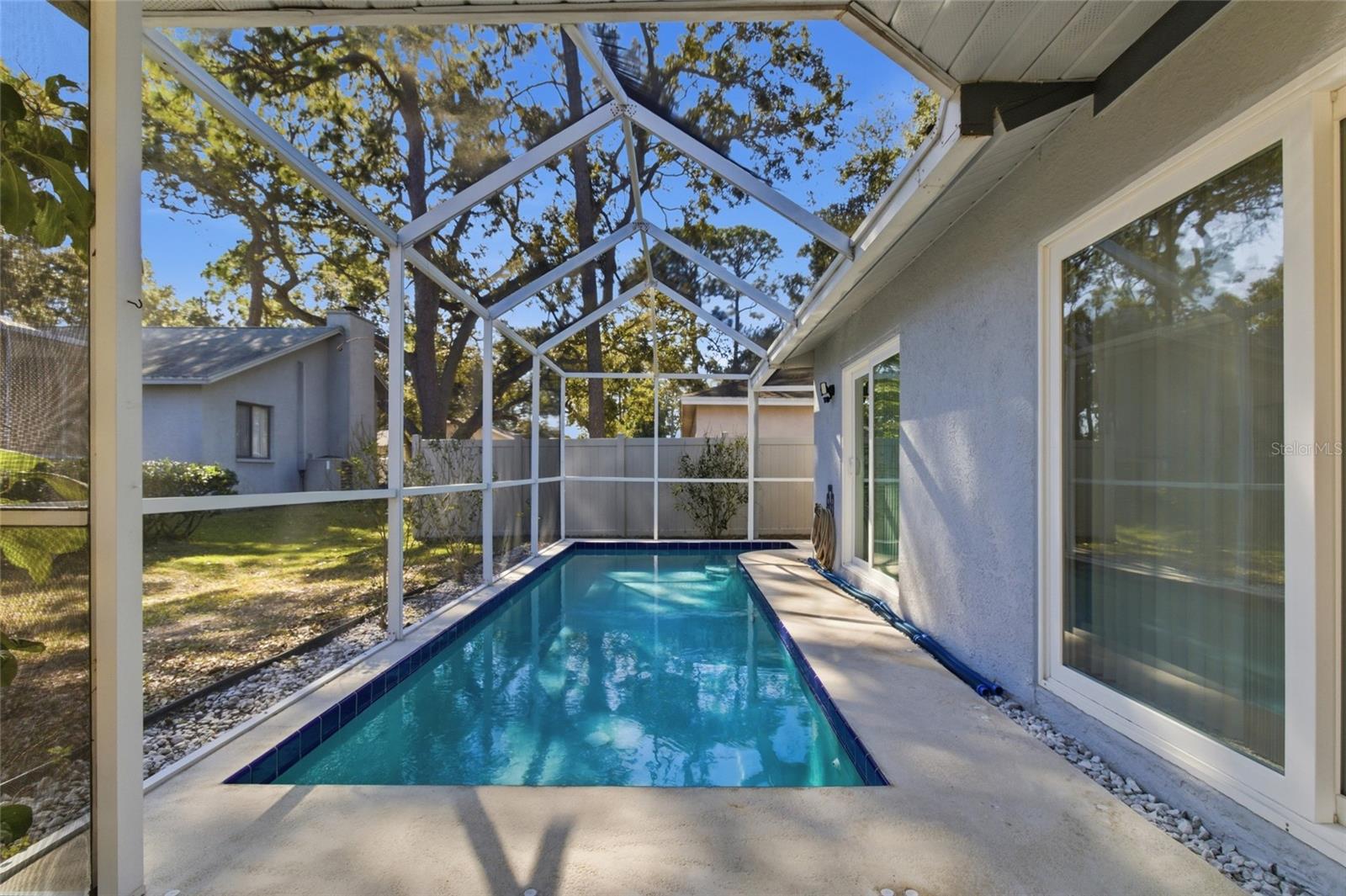 Screened Lanai and 25' x 8' Pool with Pool Sweep and safety fencing