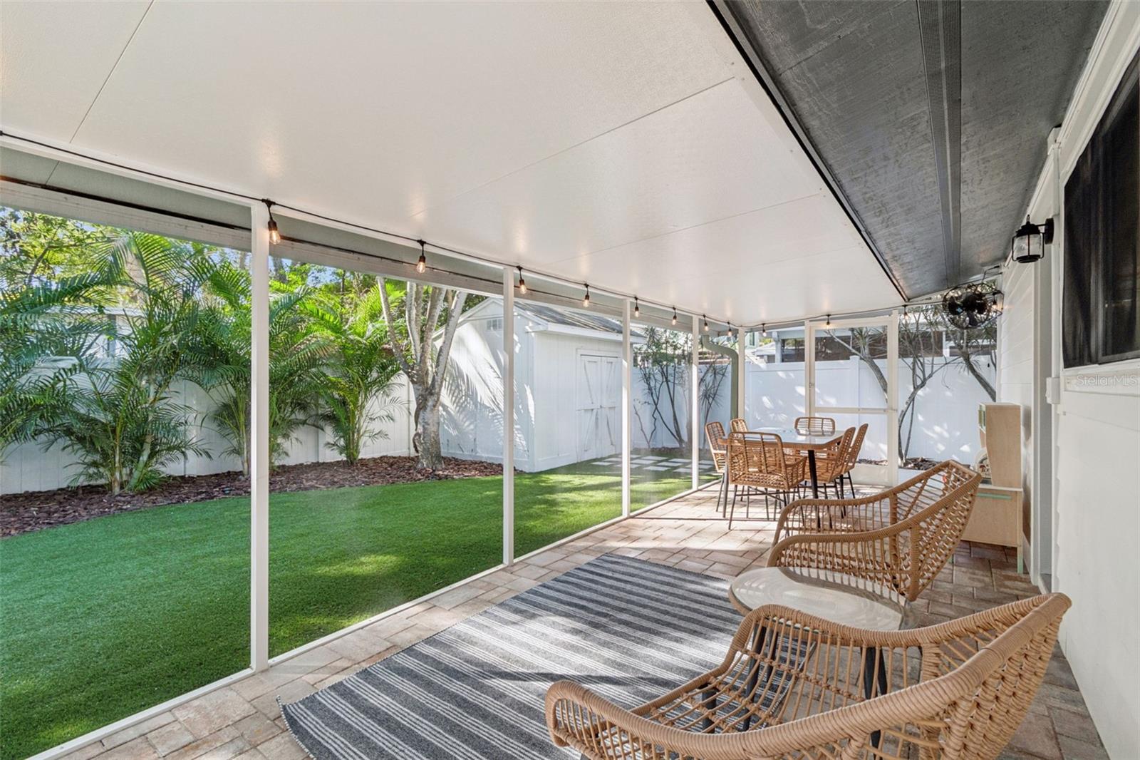 Screened in Lanai w/ Brick Pavers Overlooking the Spacious Turfed Backyard