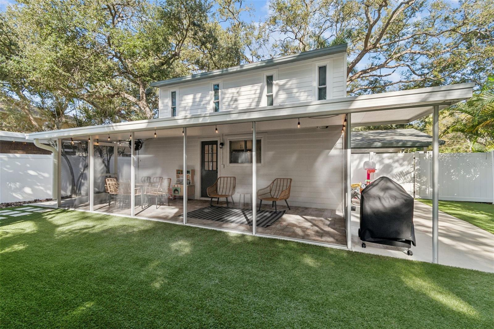 Screened in Lanai w/ Brick Pavers Overlooking the Spacious Turfed Backyard