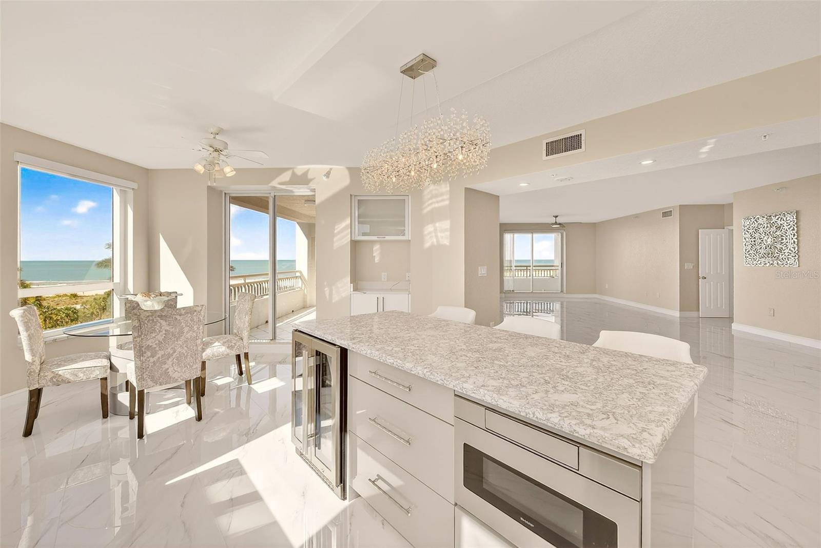 Large island with wine cooler, drawer storage and microwave.