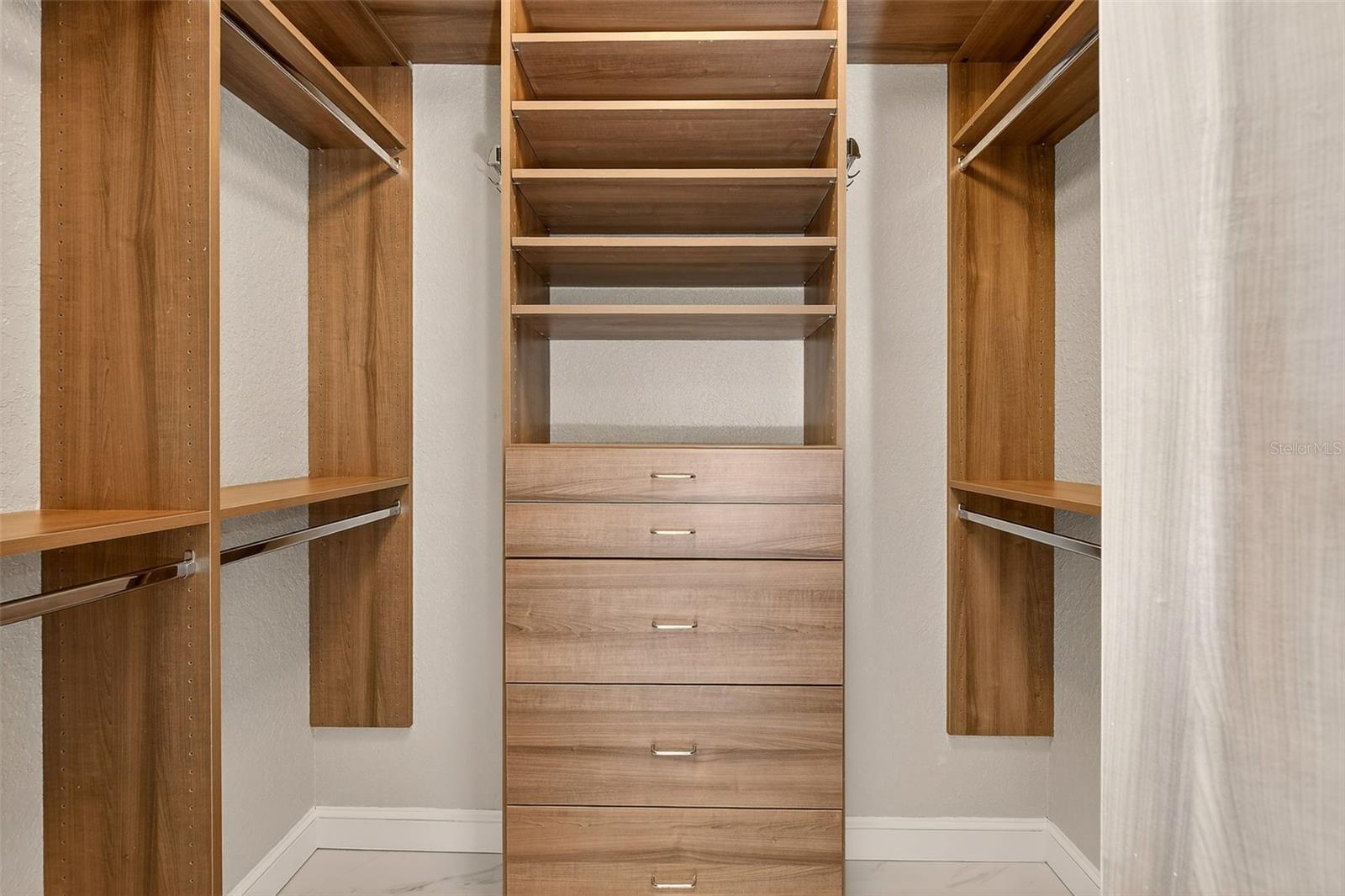Primary suite: His custom built-in closet
