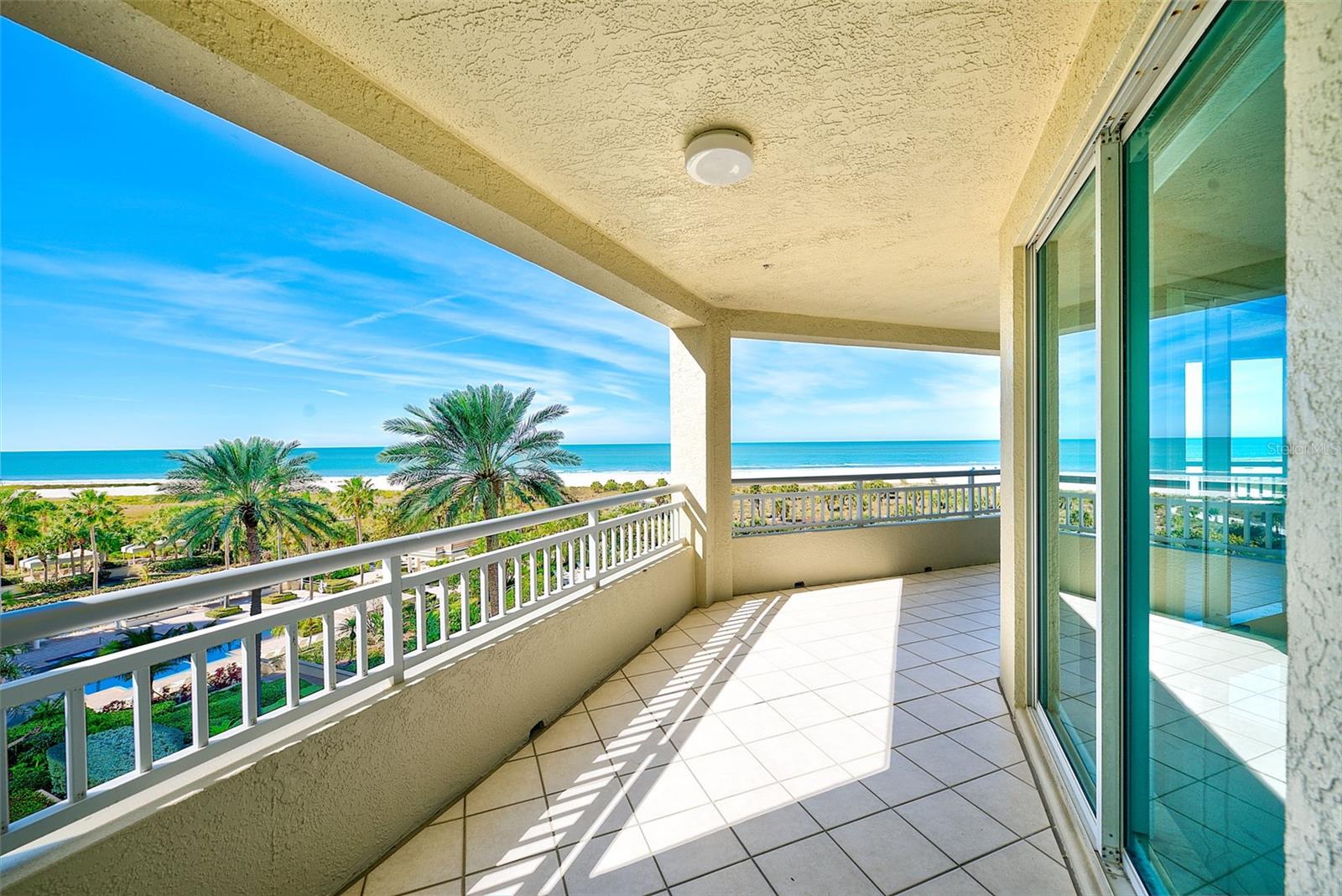 Huge balcony spanning the width of the kitchen to the primary bedroom.