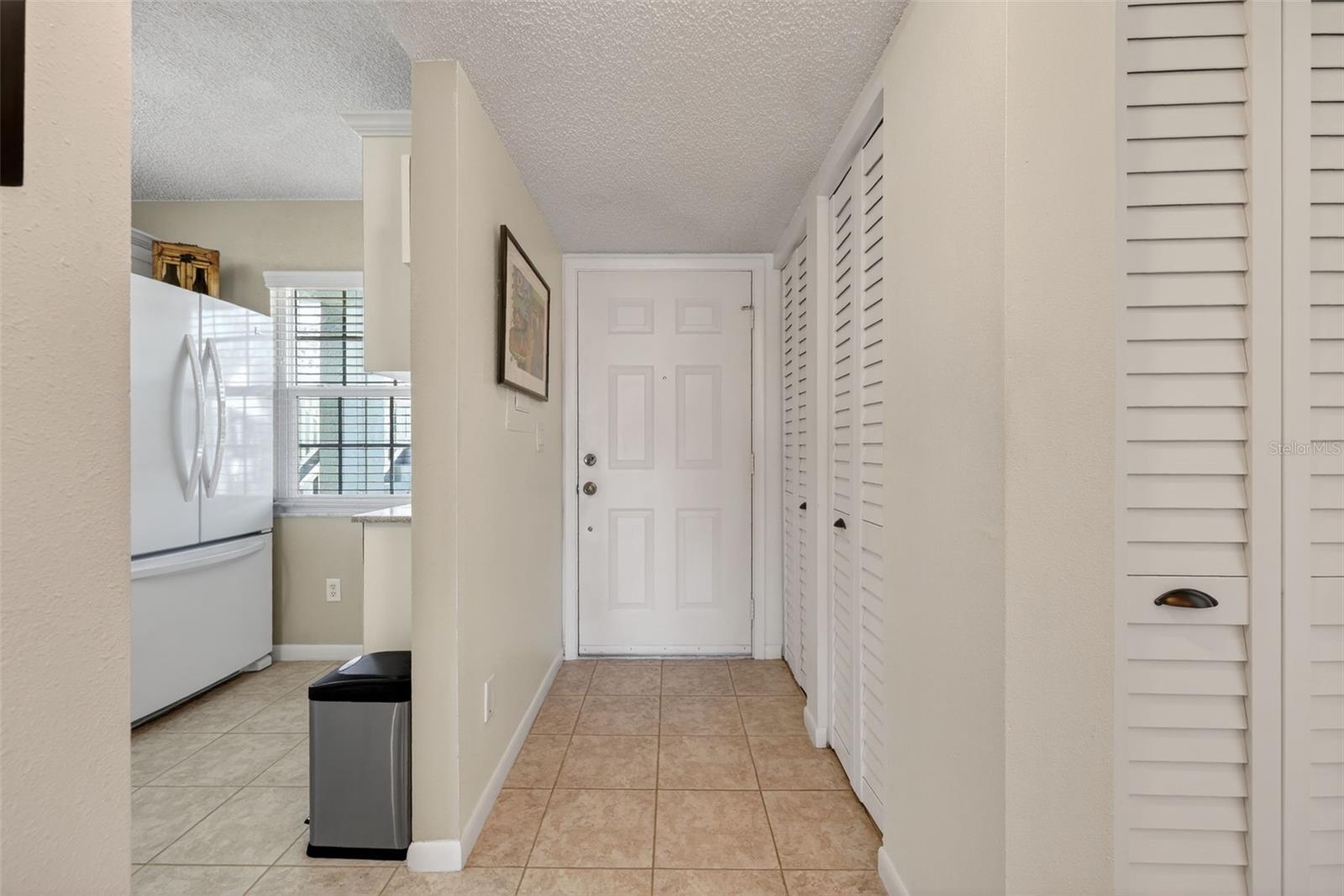 Lovely entry way, leading into unit with storage closets