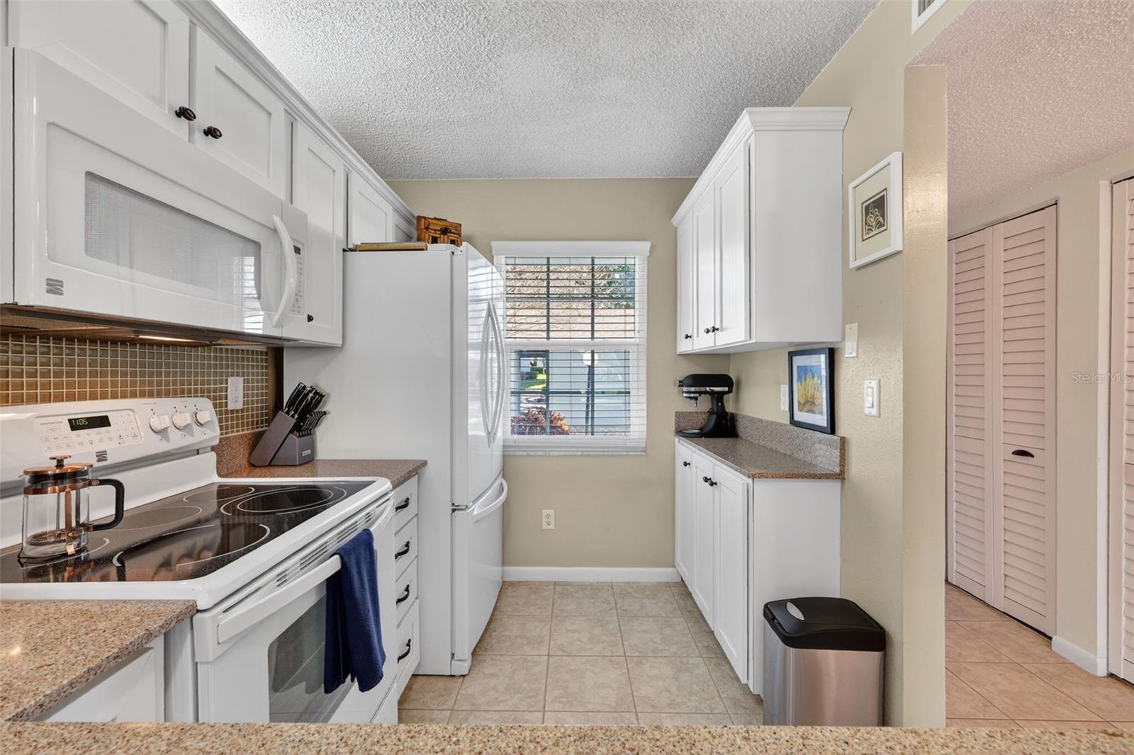 Extra Counter and storage cabinets and lots of light through your window