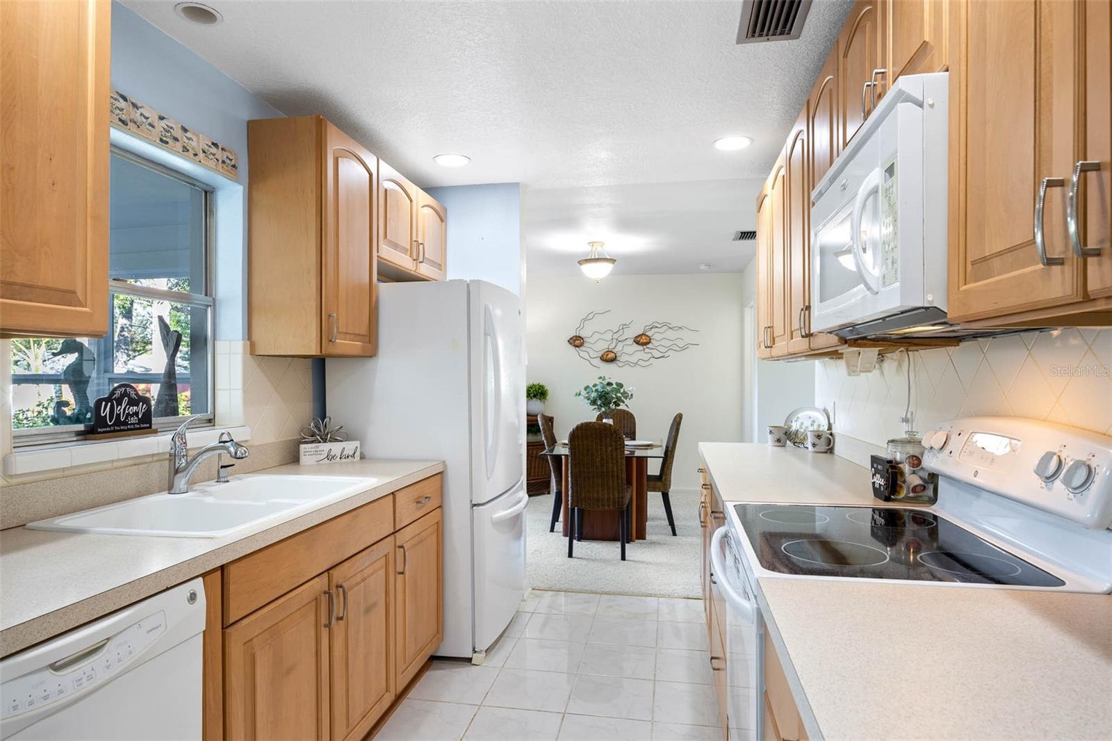 The Kitchen overlooks the Florida Room and Backyard