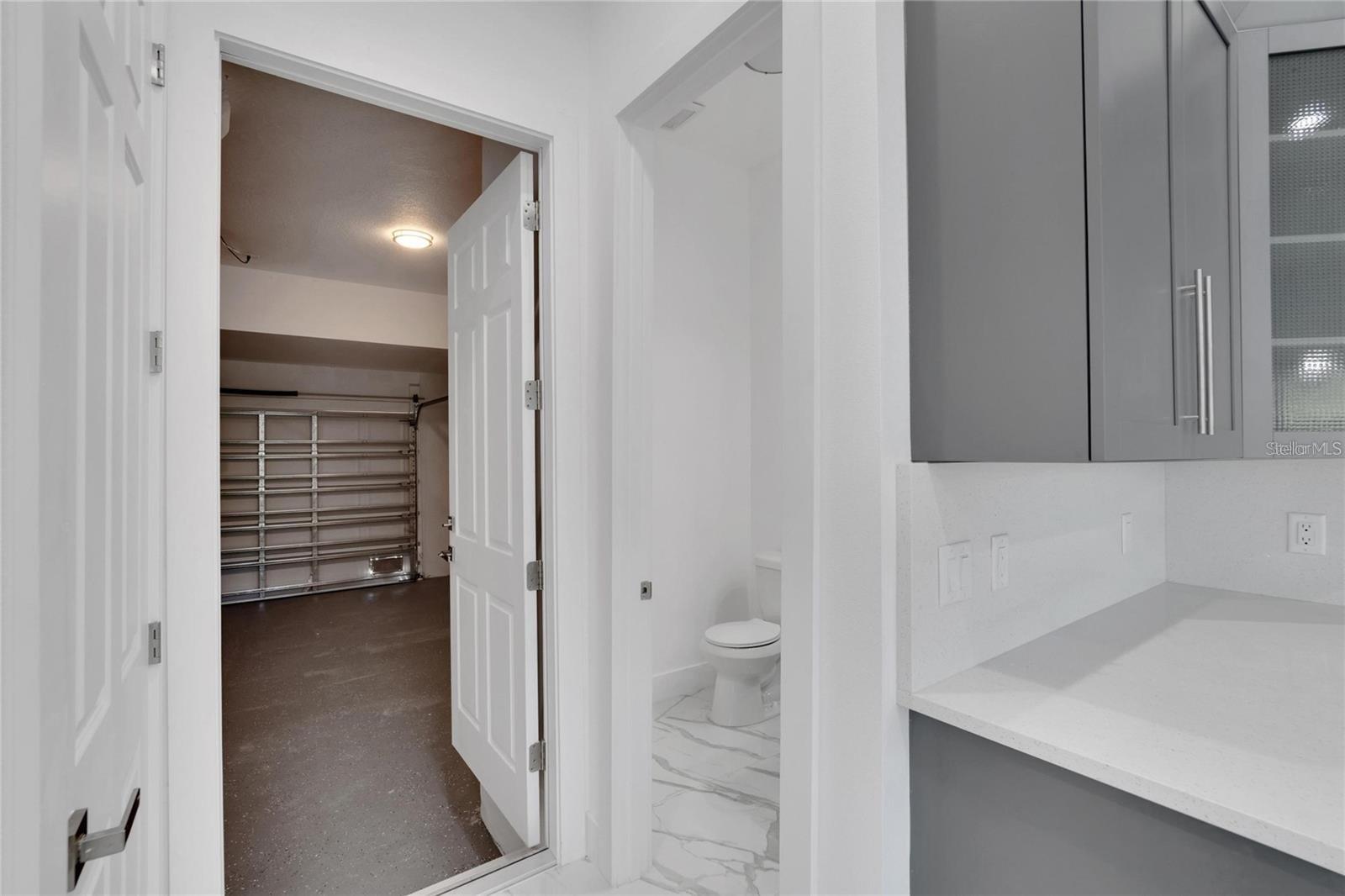 Half bath off kitchen & garage entrance