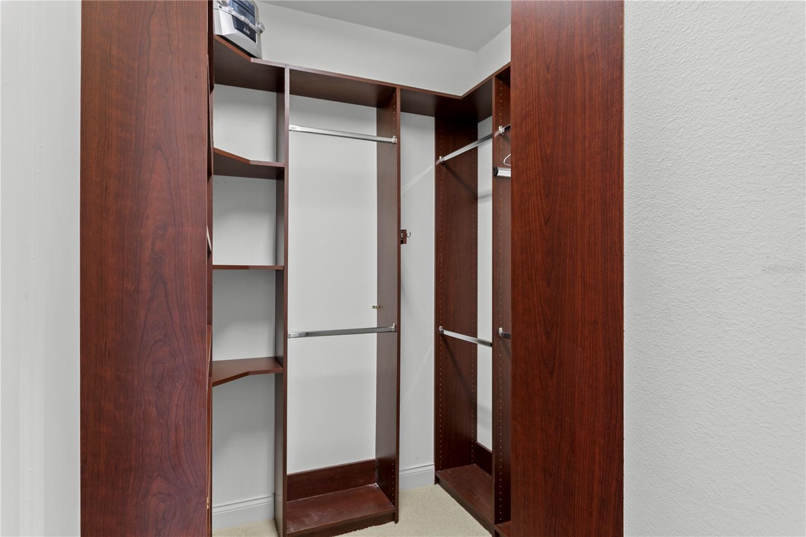 His-and-hers walk-in closets offer excellent organizational space.