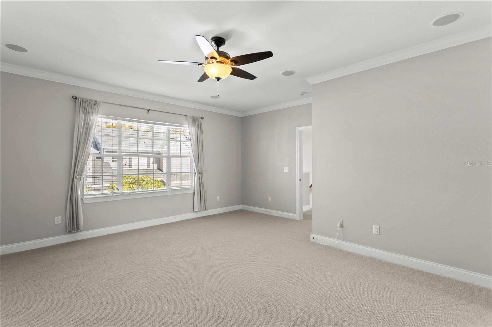 The spacious primary bedroom