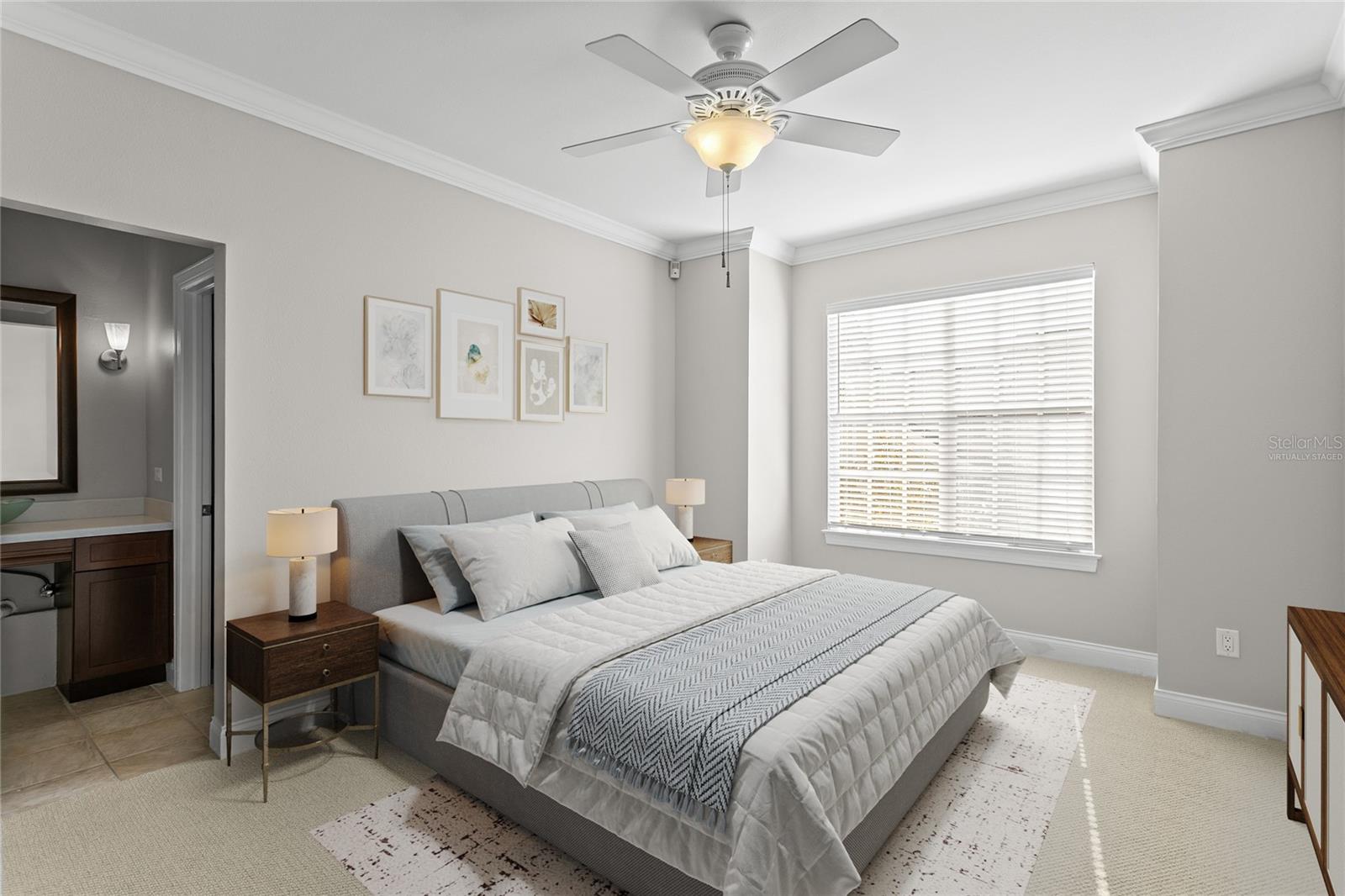 Virtually staged image of the secondary bedroom with walk in closet and jack and jill bathroom with the third bedroom.