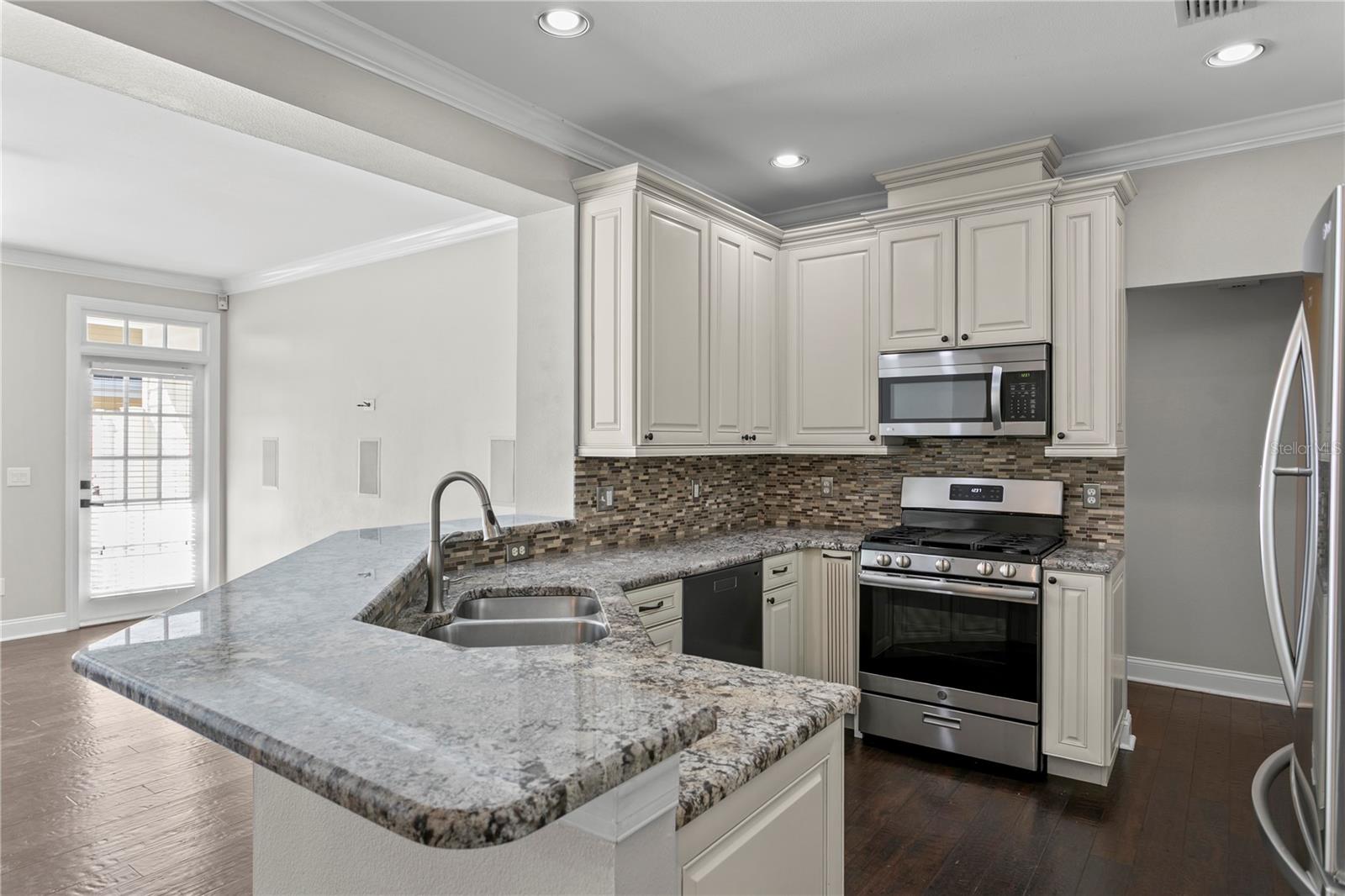Nicely updated kitchen with an open-concept layout that flows seamlessly into the family room, allowing you to stay connected while prepping meals.