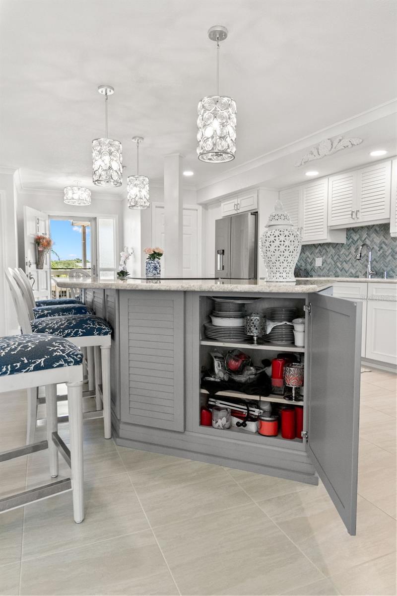 Large center island offers prep space, seating, and additional storage.