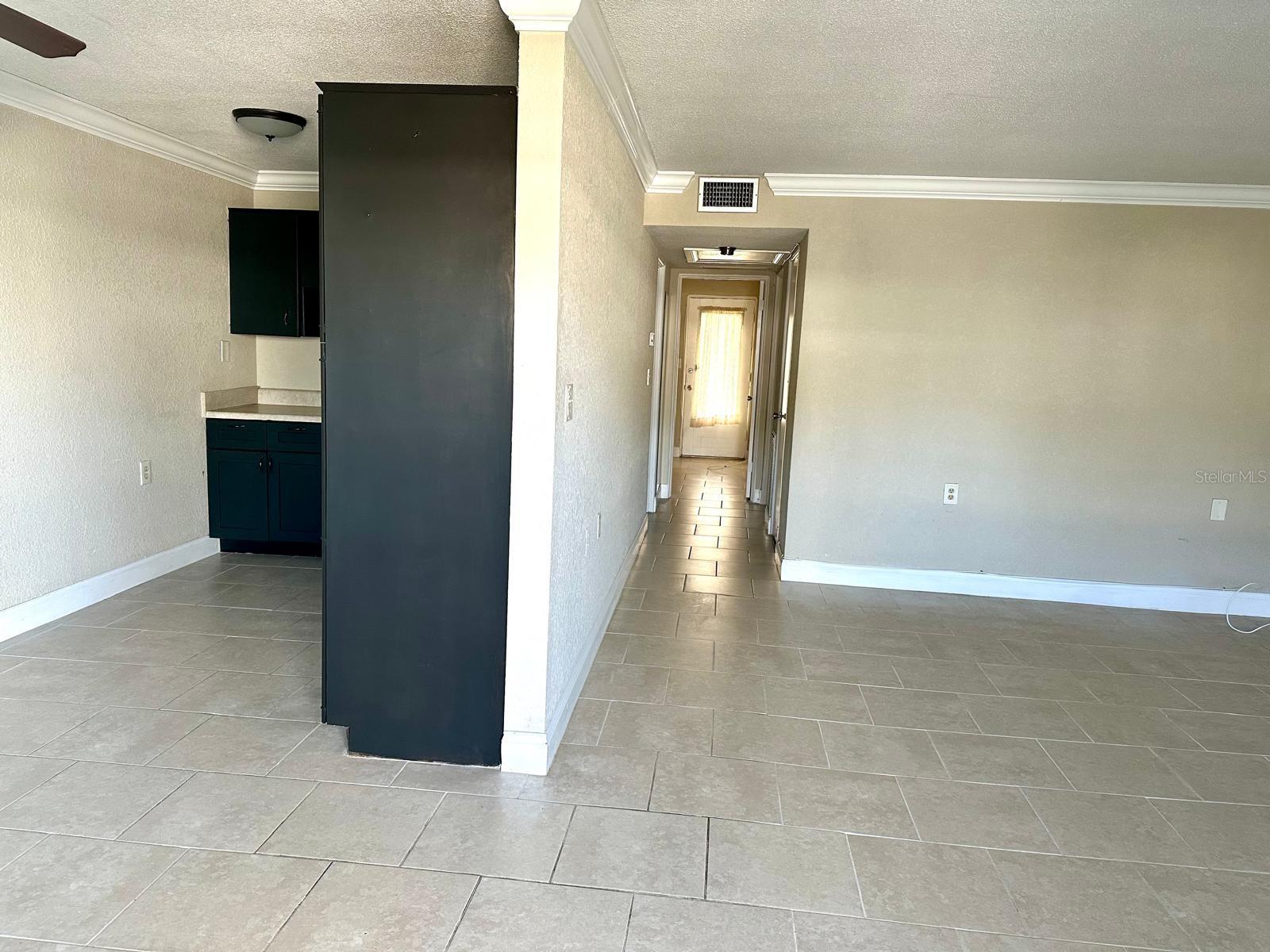 VIEW FROM THE FRONT DOOR- LIVING ROOM ON THE RIGHT & KITCHEN ON THE LEFT