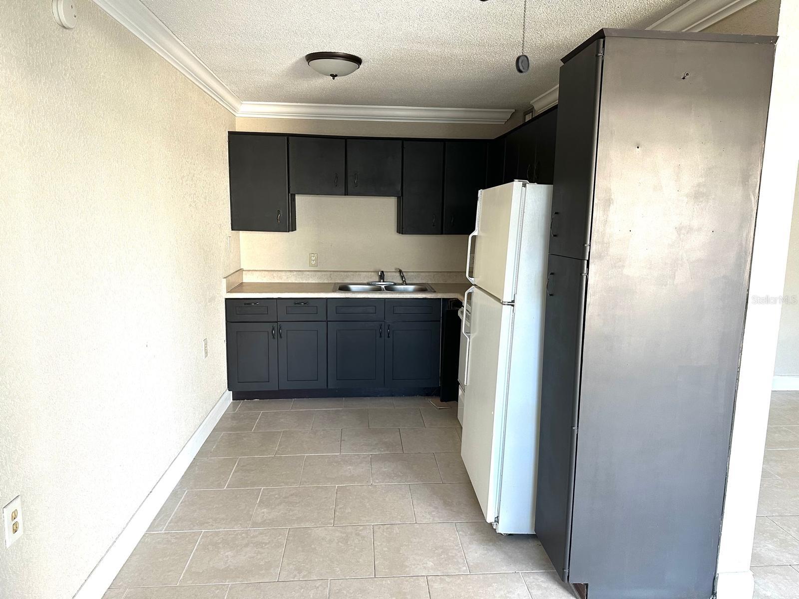 VIEW OF KITCHEN FROM THE DINING ROOM