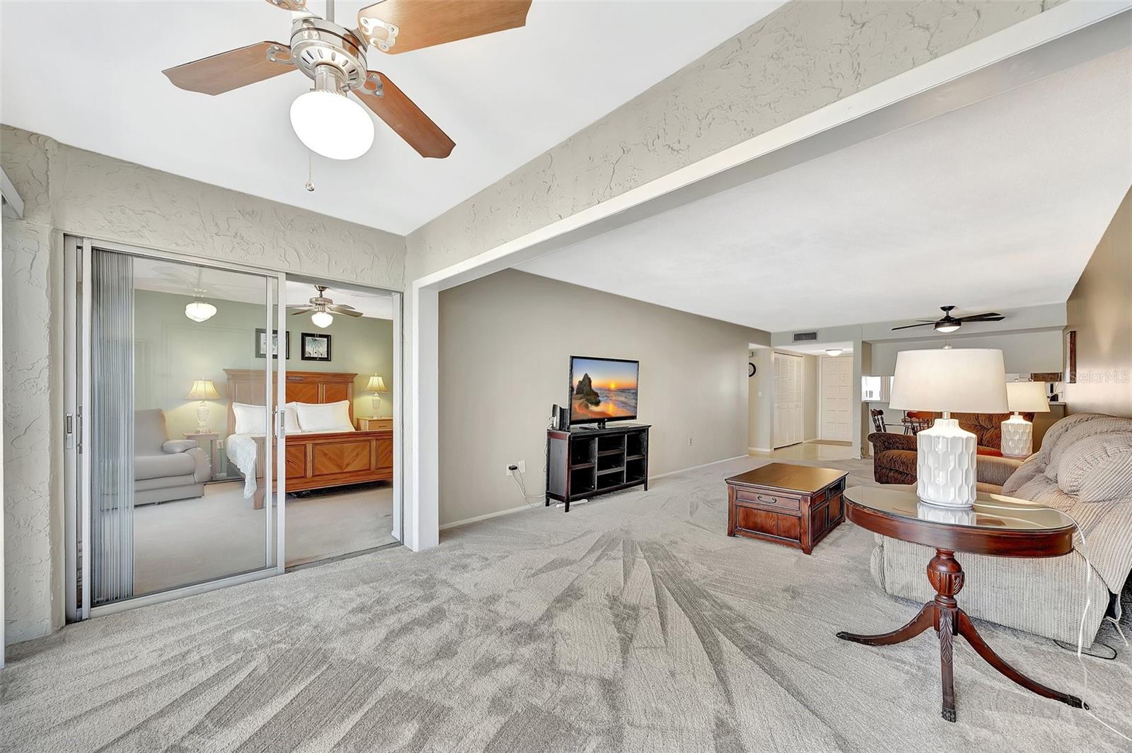 The main bedroom has slider to sunroom area