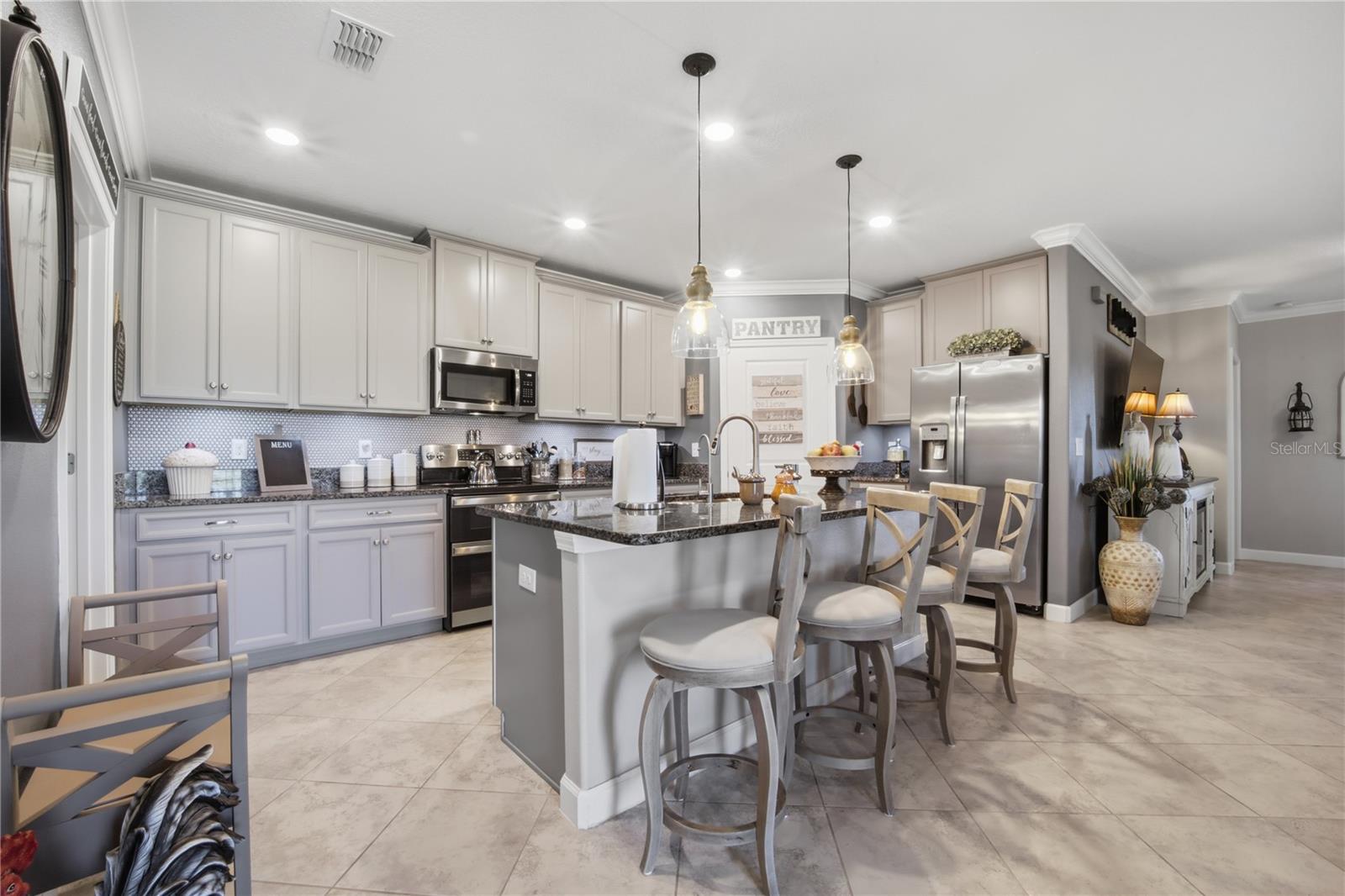 OPEN kitchen with Generous cabinets and pendant lights