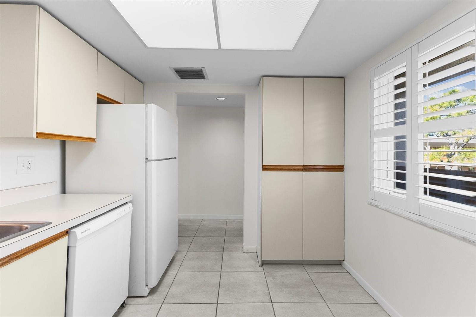 Kitchen showing pantry closet