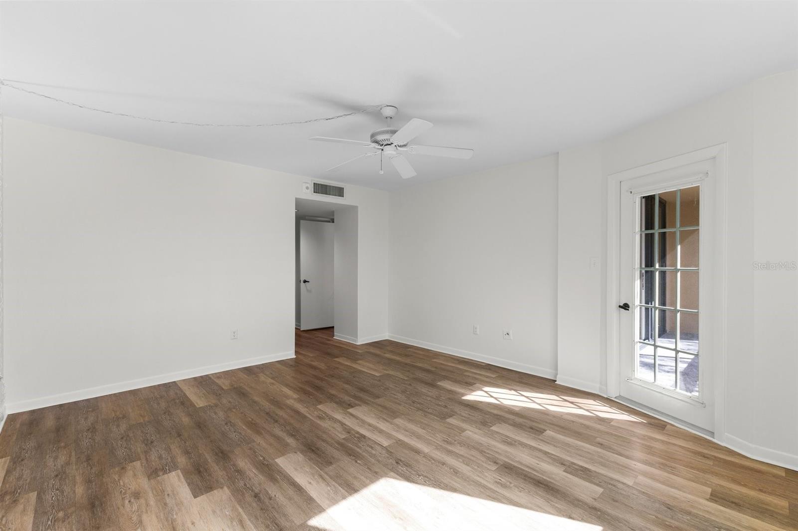 Primary master bedroom with access to patio