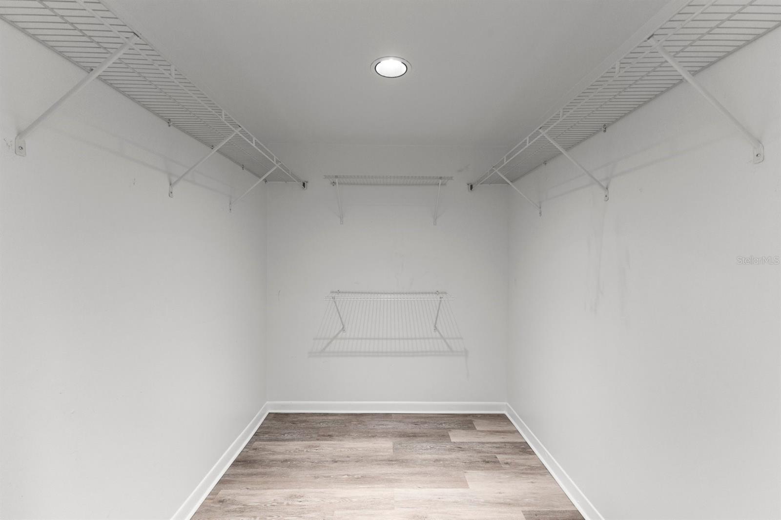 Walk in closet in primary bedroom