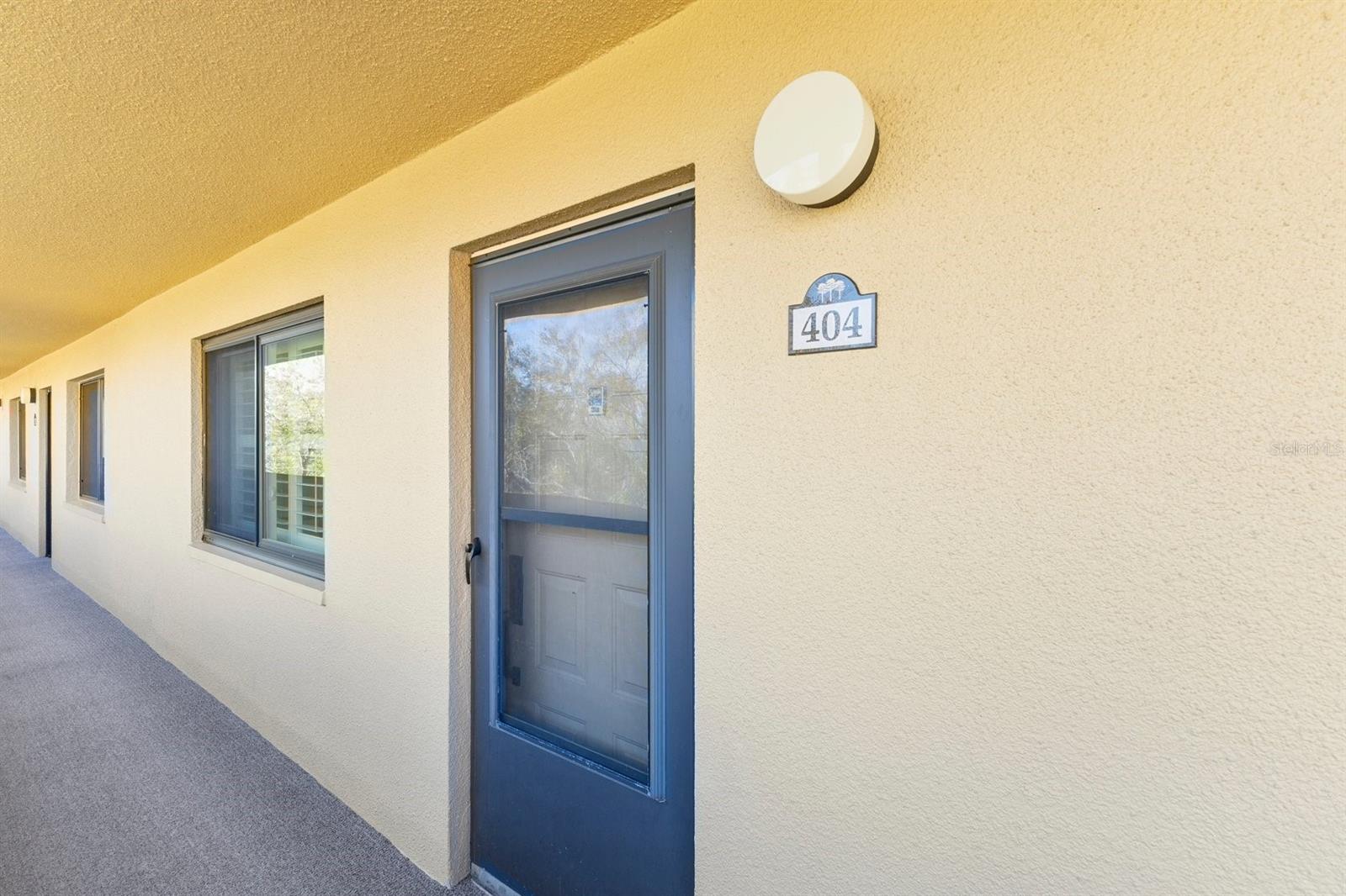 Entry with storm door and high end new windows