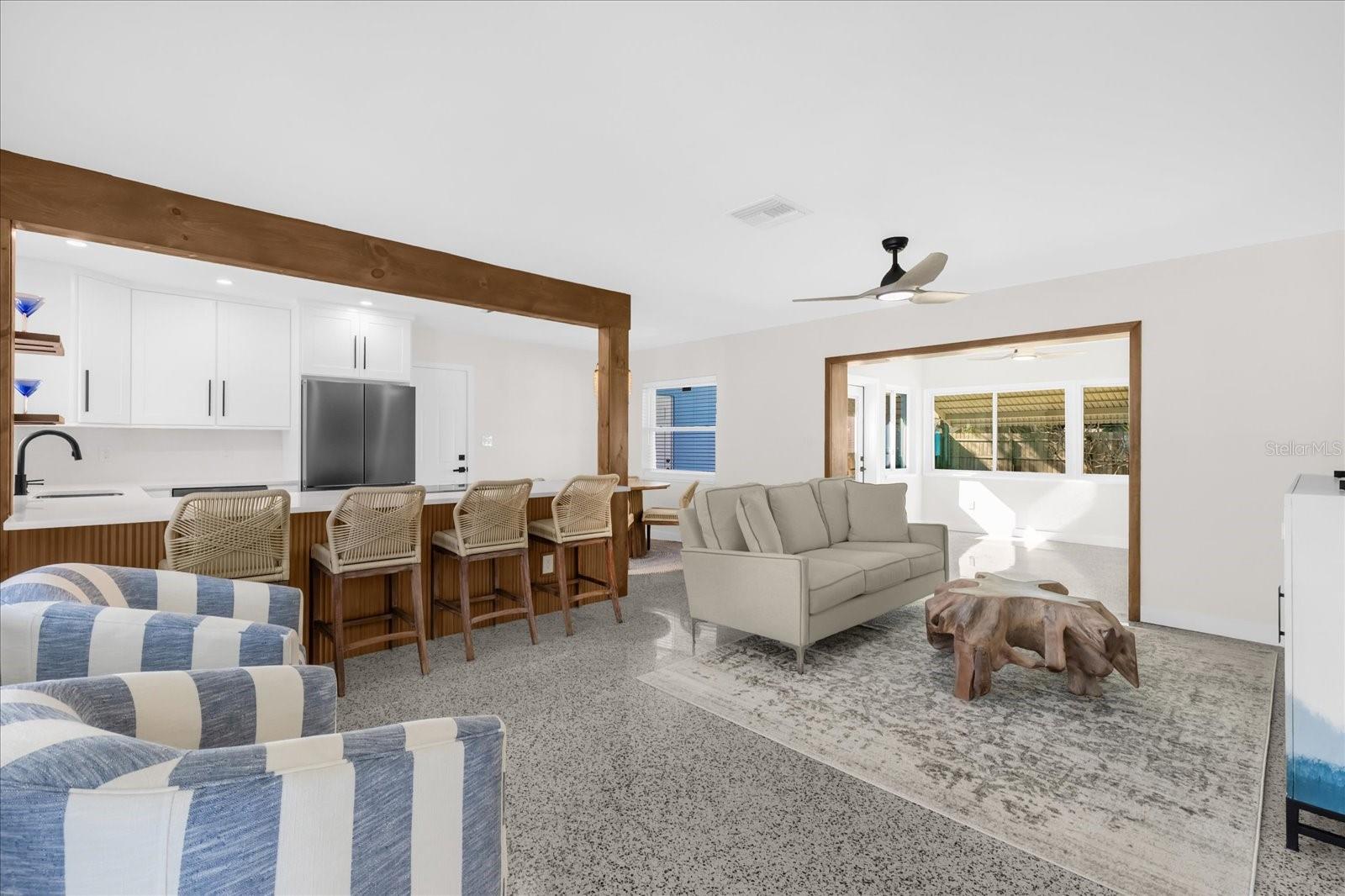 View from front door looking into Living Room, Kitchen and Florida/Sunroom