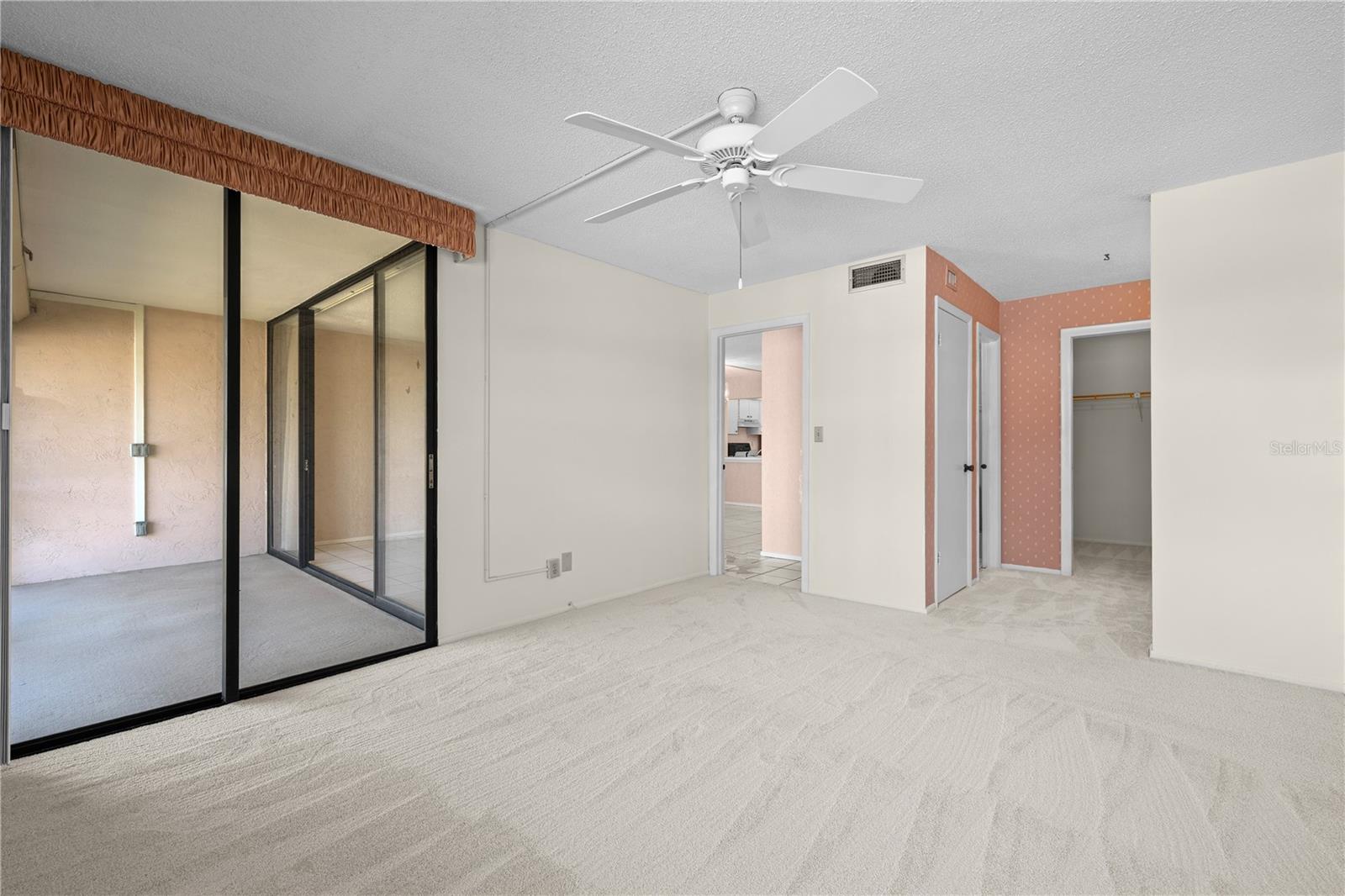 Primary bedroom with patio access